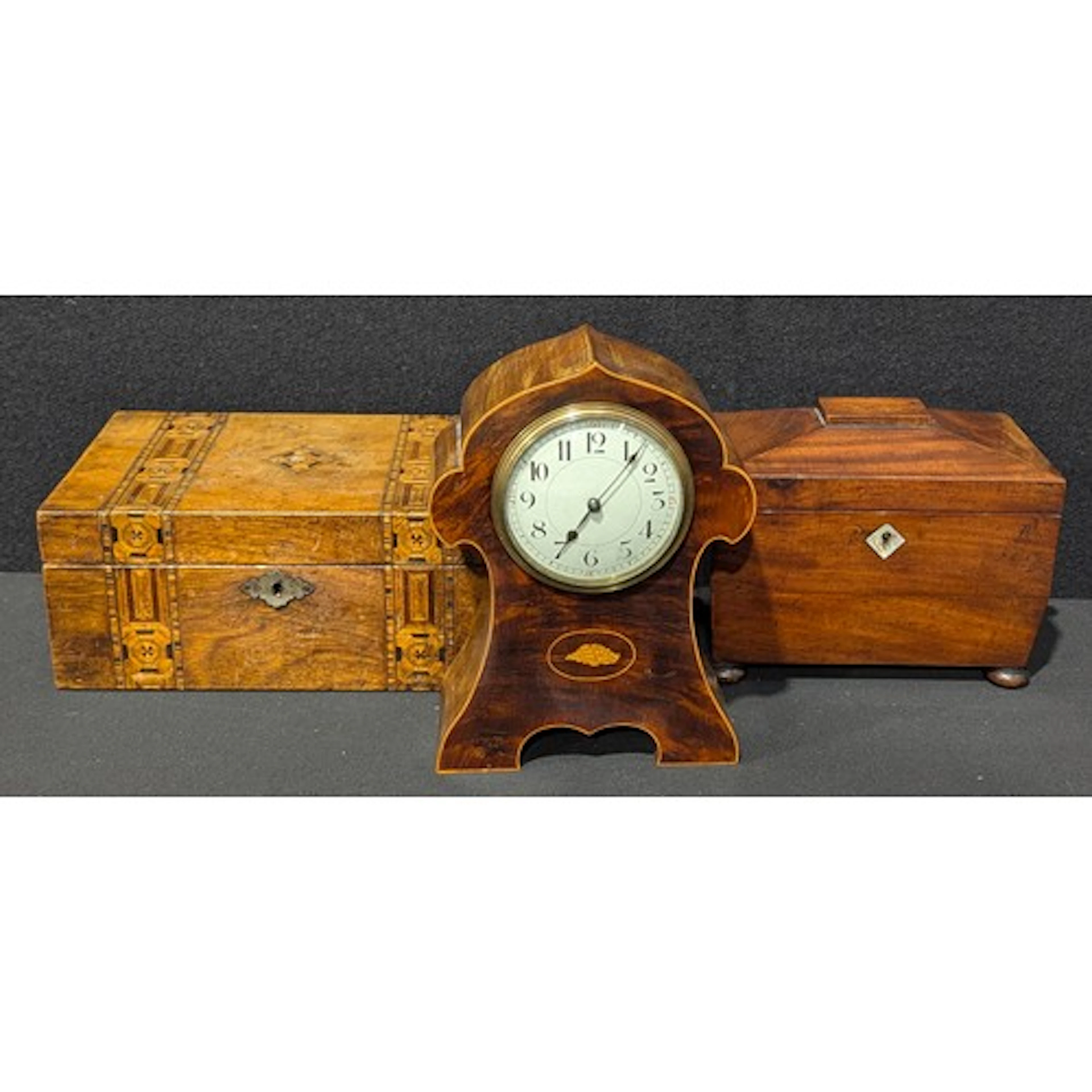 A 19th century mahogany sarcophagus tea caddy, hinged cover ...
