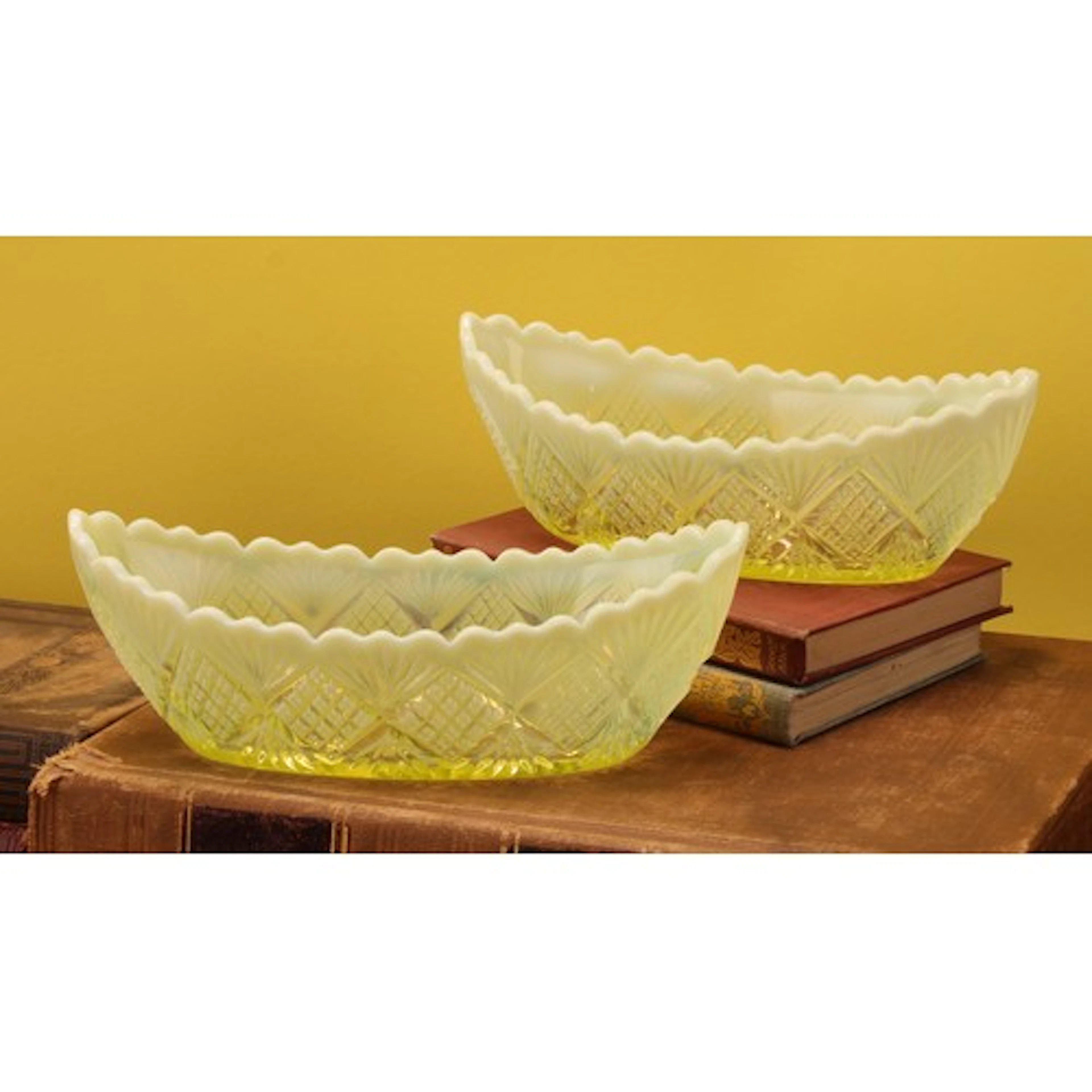 A pair of Victorian uranium and vaseline pressed glass navet...