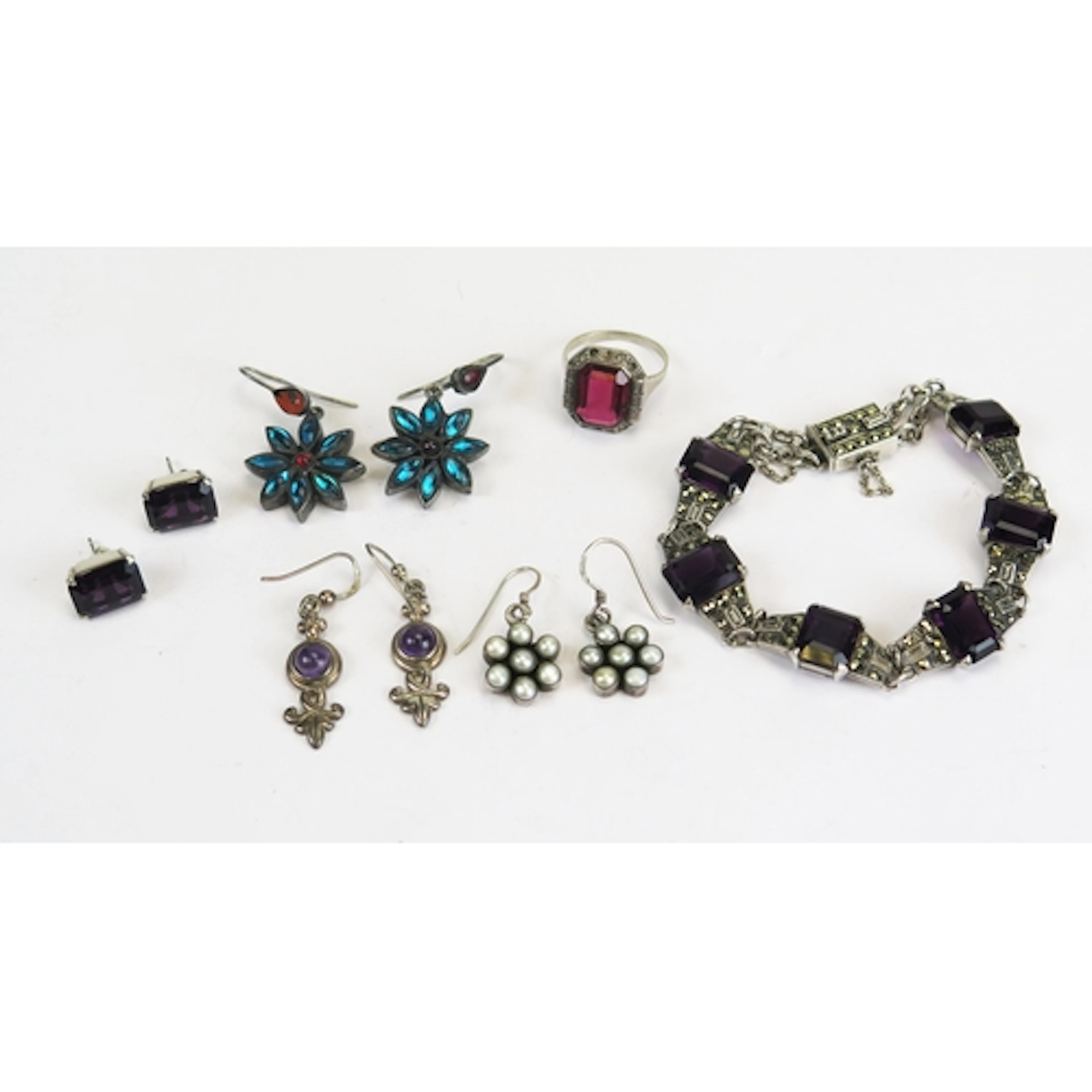 A silver, marcasite and 'amethyst' paste bracelet with match...