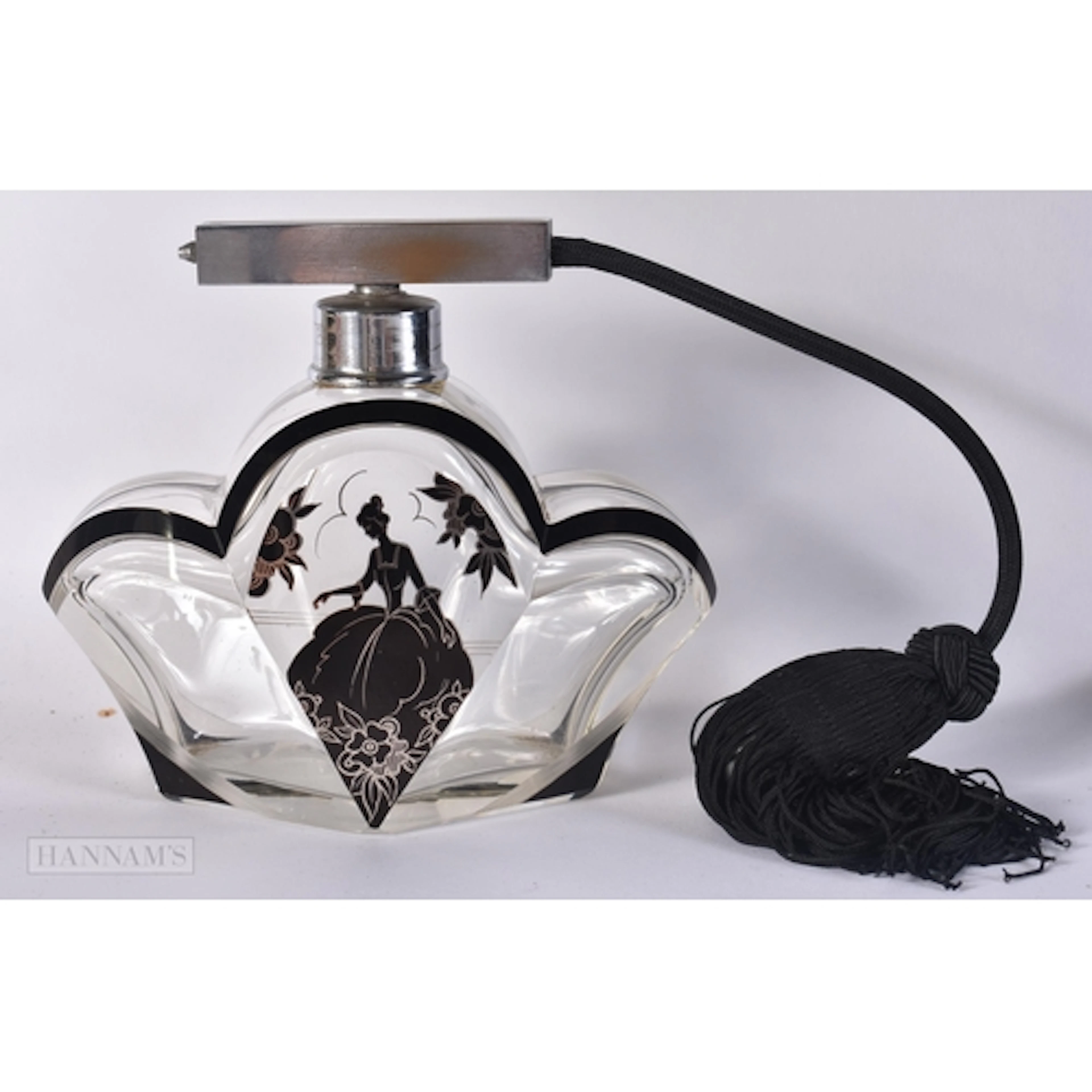 AN ART DECO ENAMELLED GLASS SCENT BOTTLE painted with a fema...