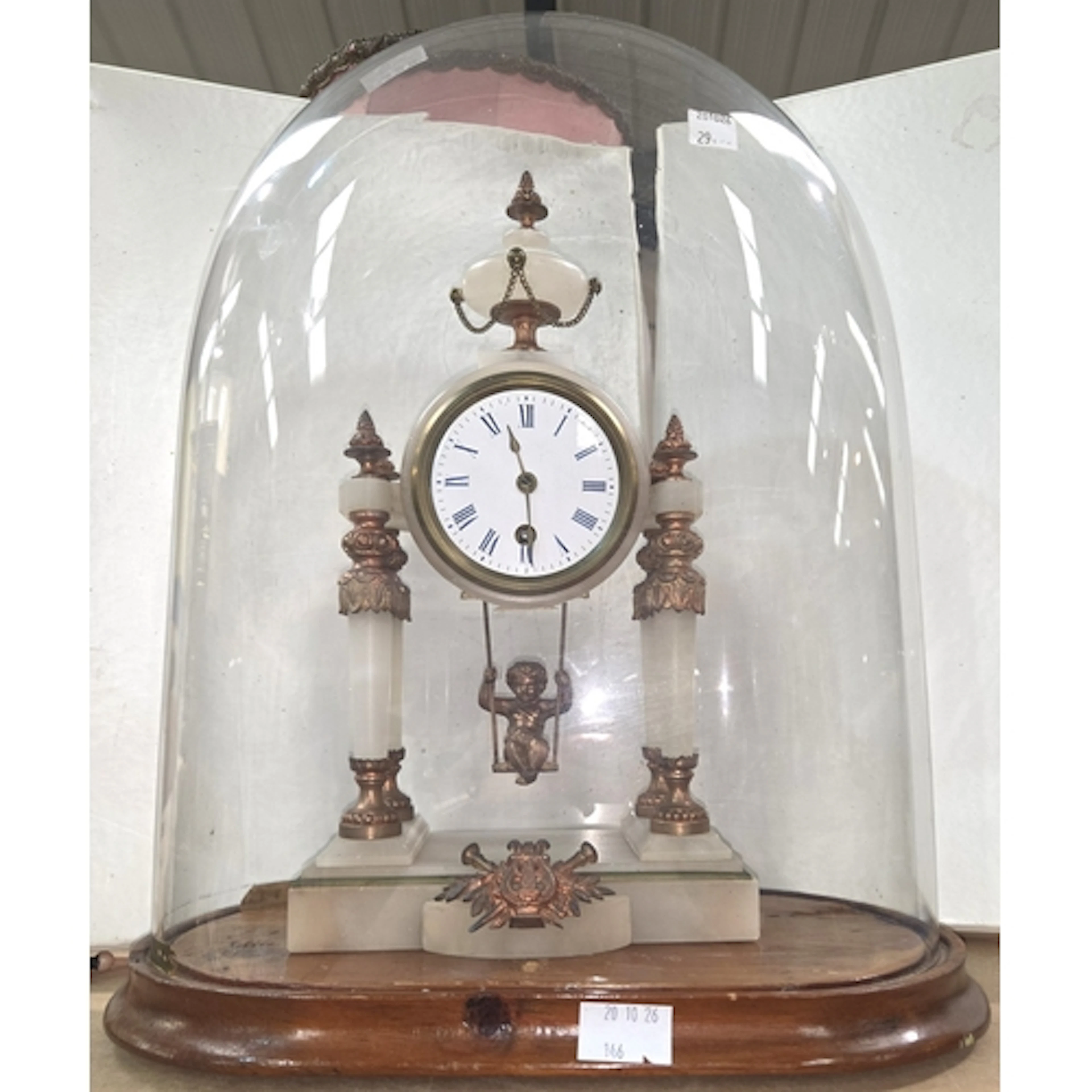 A 19th century French marble and bronze clock with copper an...