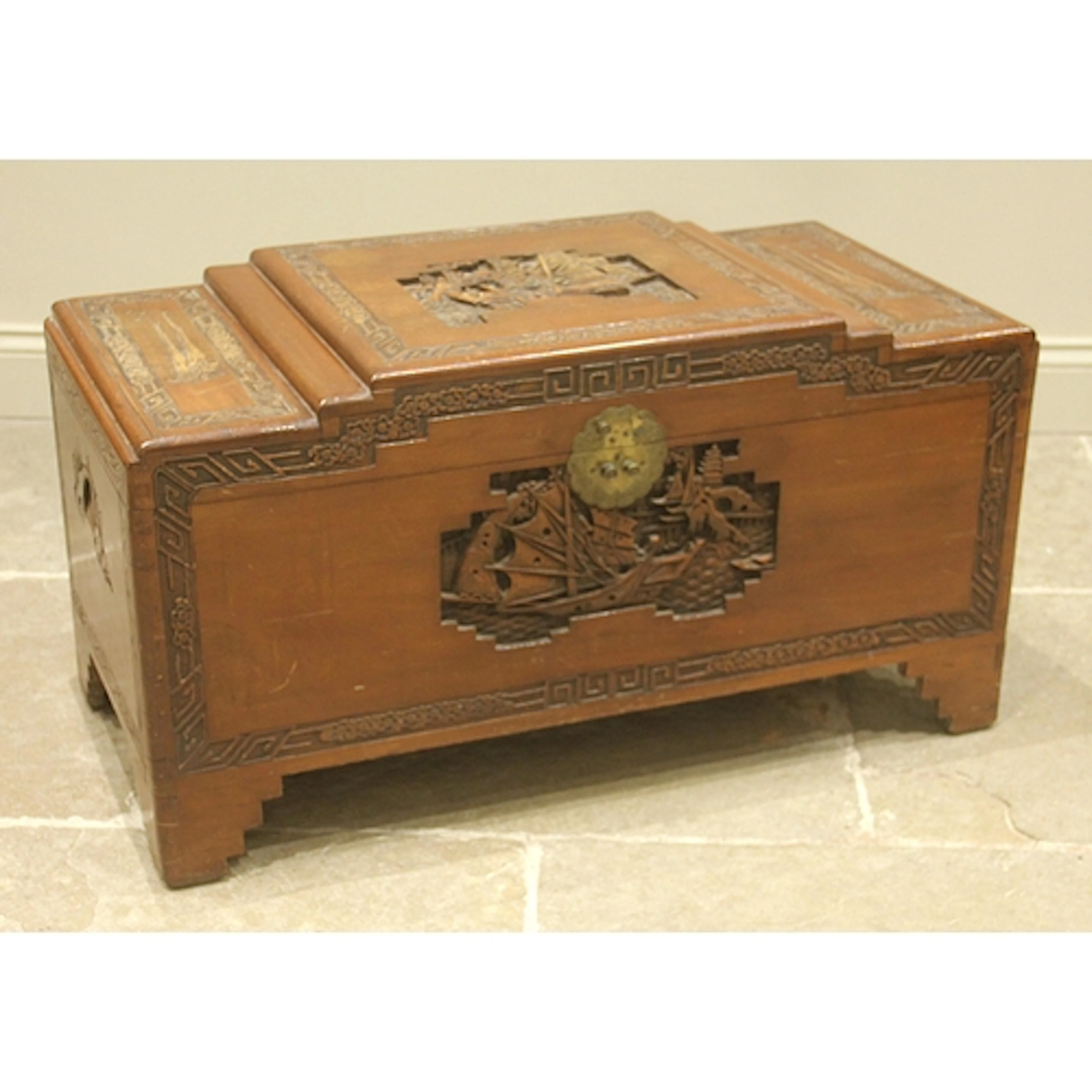 A Chinese camphor chest, mid 20th century, having a stepped ...