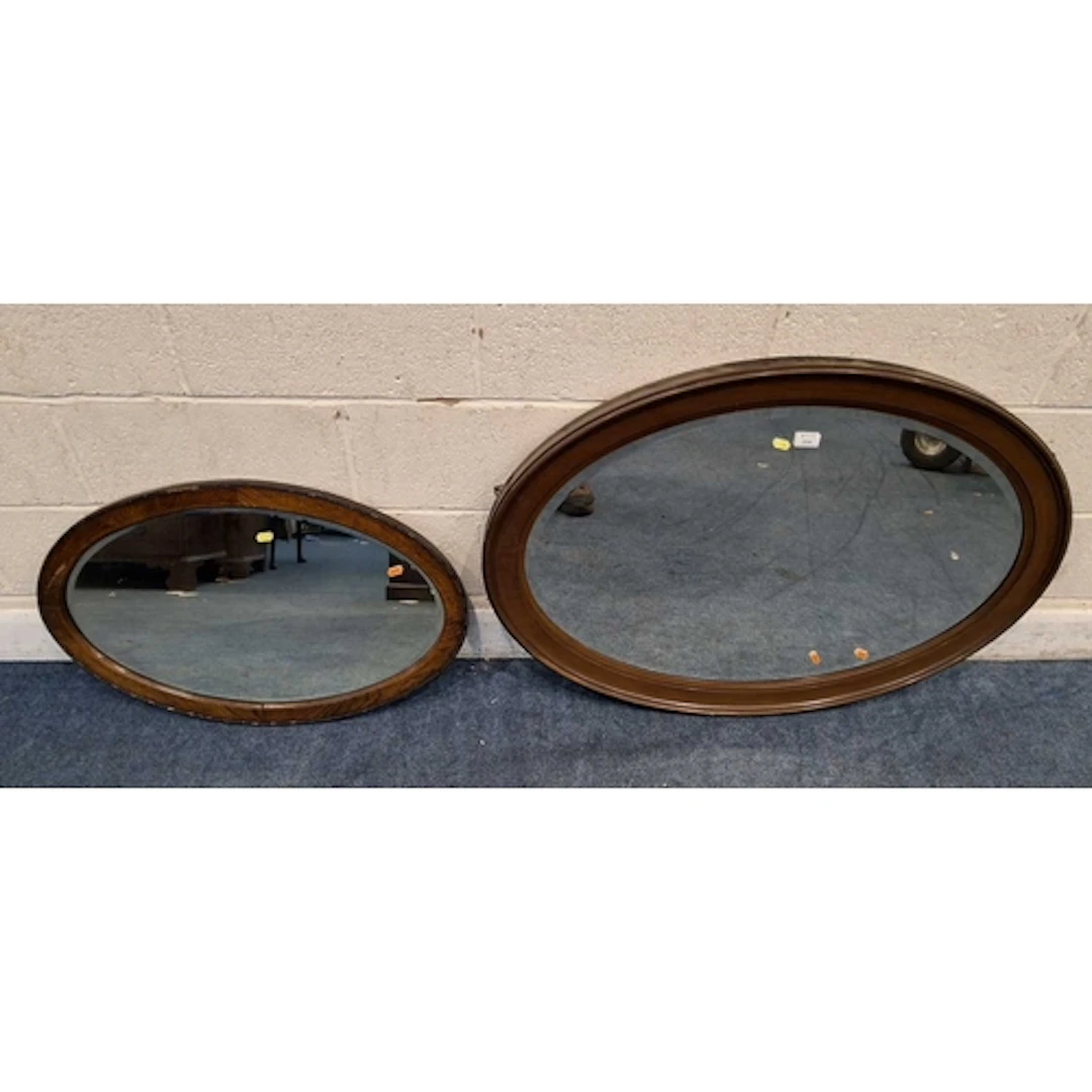 TWO OVAL BEVELLED EDGE WALL MIRRORS (larger mirror 102cm x ...