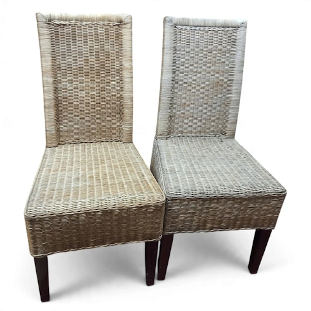 Two wicker Chairs along with an easy chair.