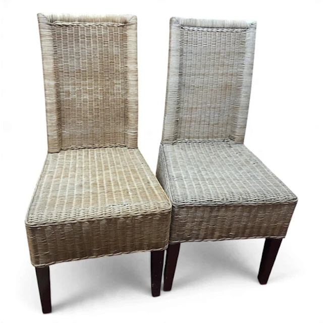 Two wicker Chairs along with an easy chair.