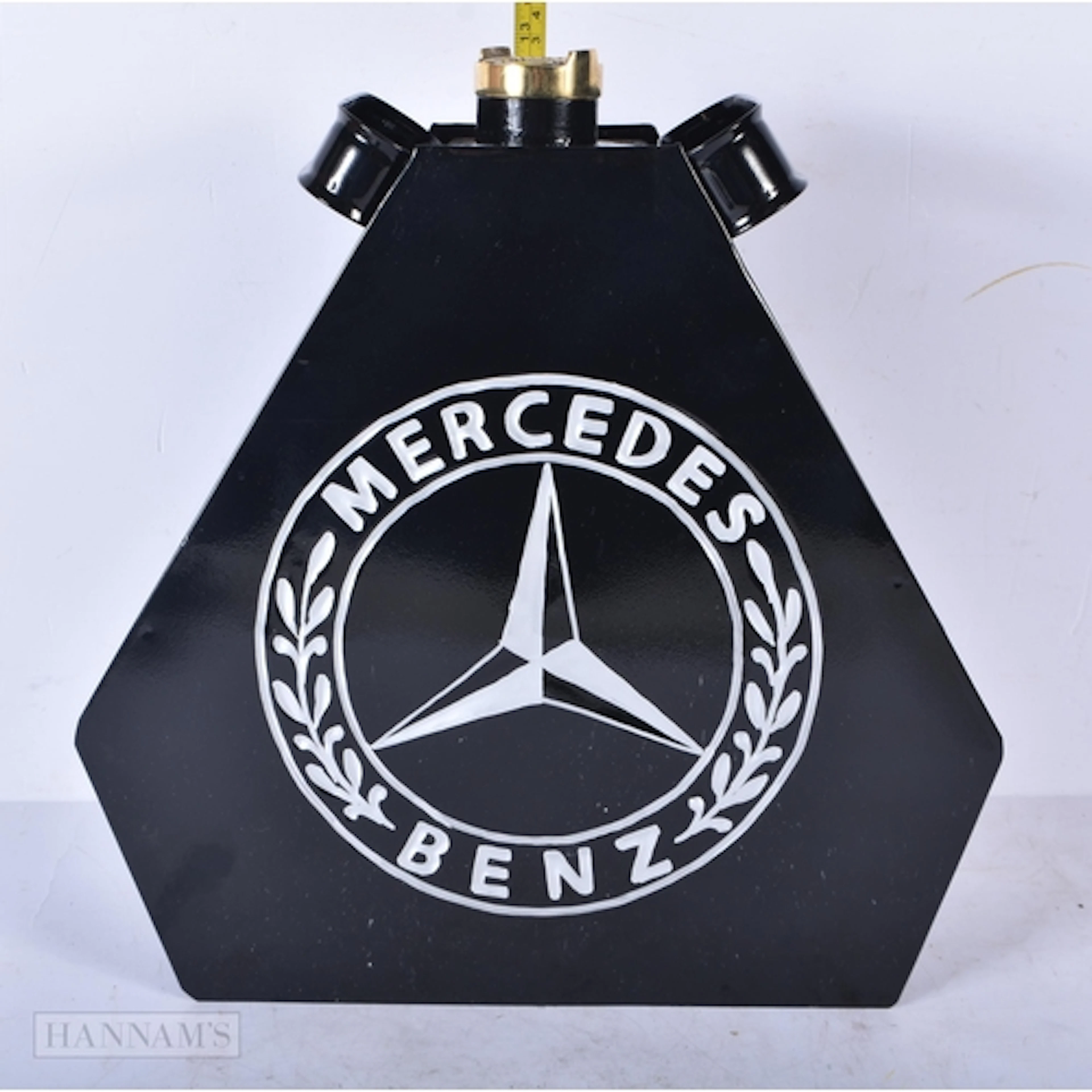 A metal enamelled Mercedes oil can 34 x 32cm