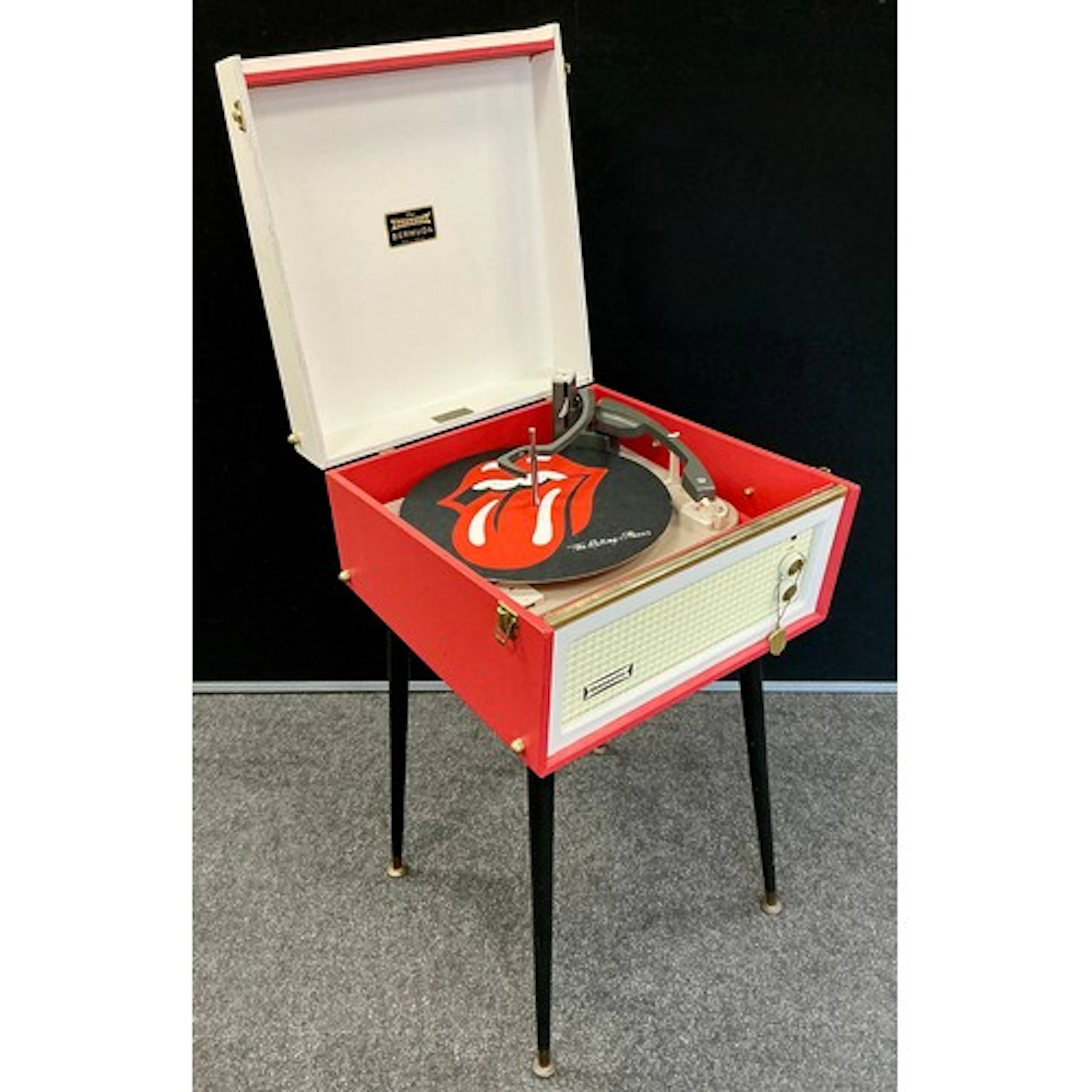 A Dansette Bermuda vintage record player, in retro red and w...