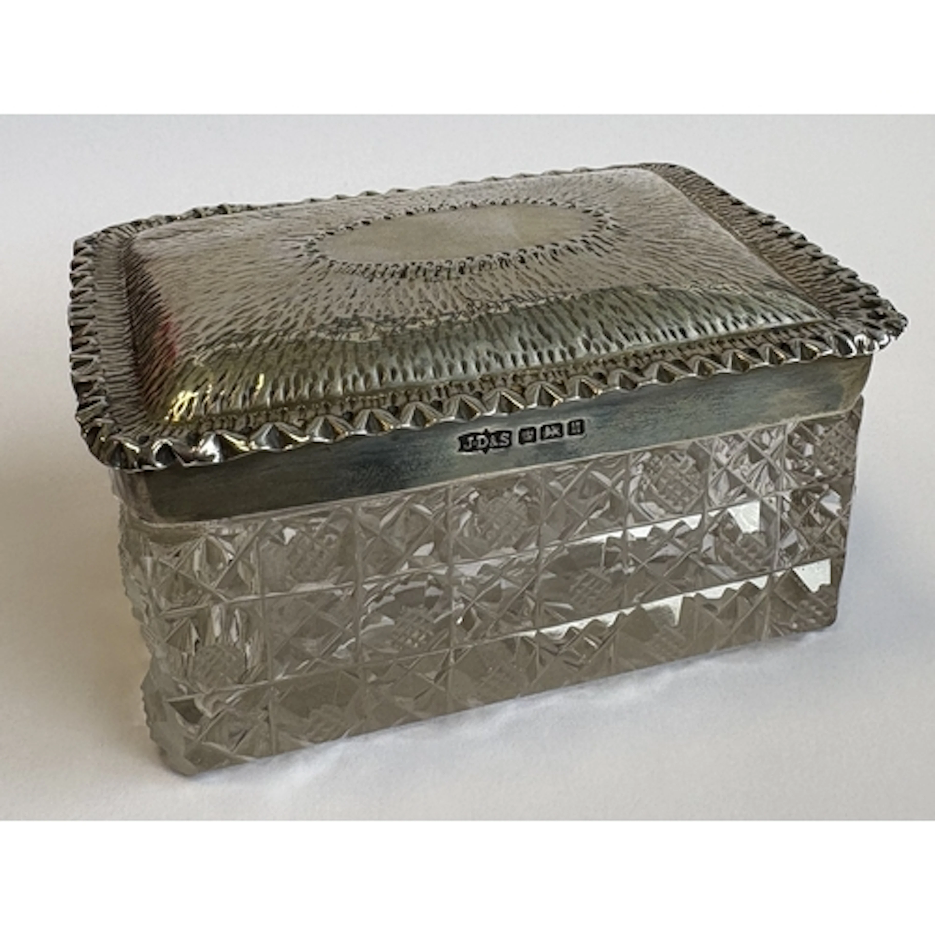 An Art Deco silver-lidded glass box with engine-turned decor...