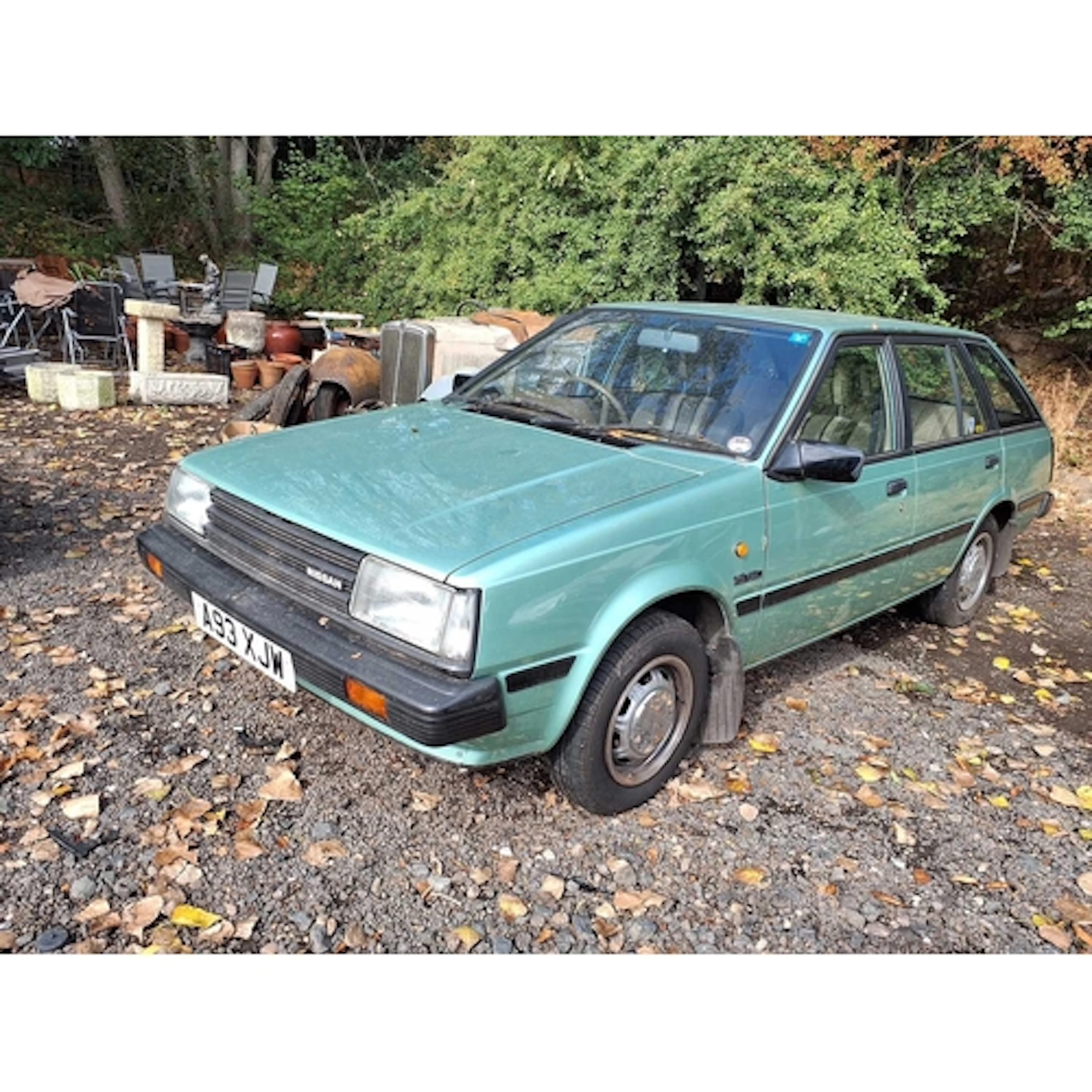 A 1984 NISSAN SUNNY 5 DOOR ESTATE CAR in green, with a 1.5L ...