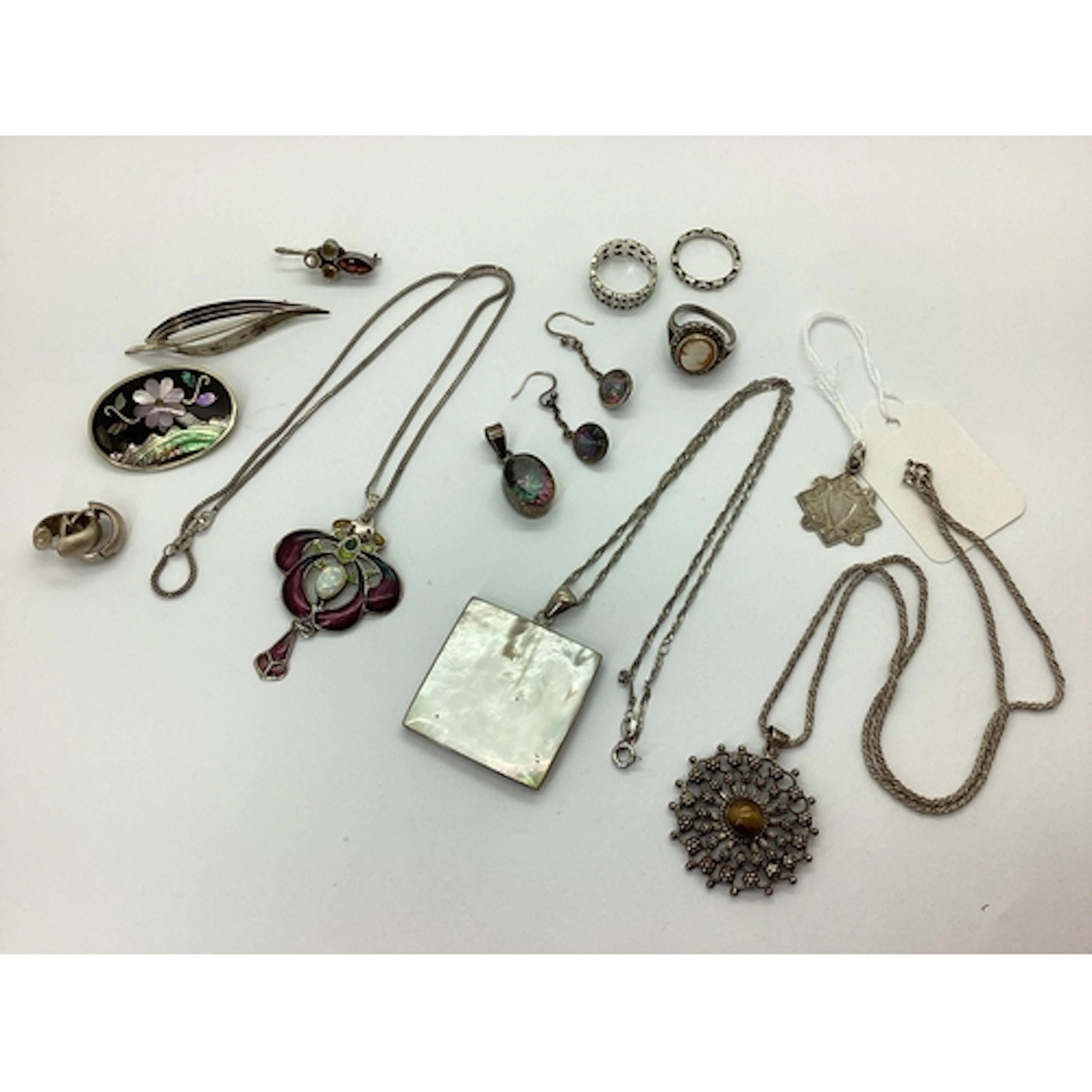 A Decorative Openwork Enamel Pendant, with centre oval colle...
