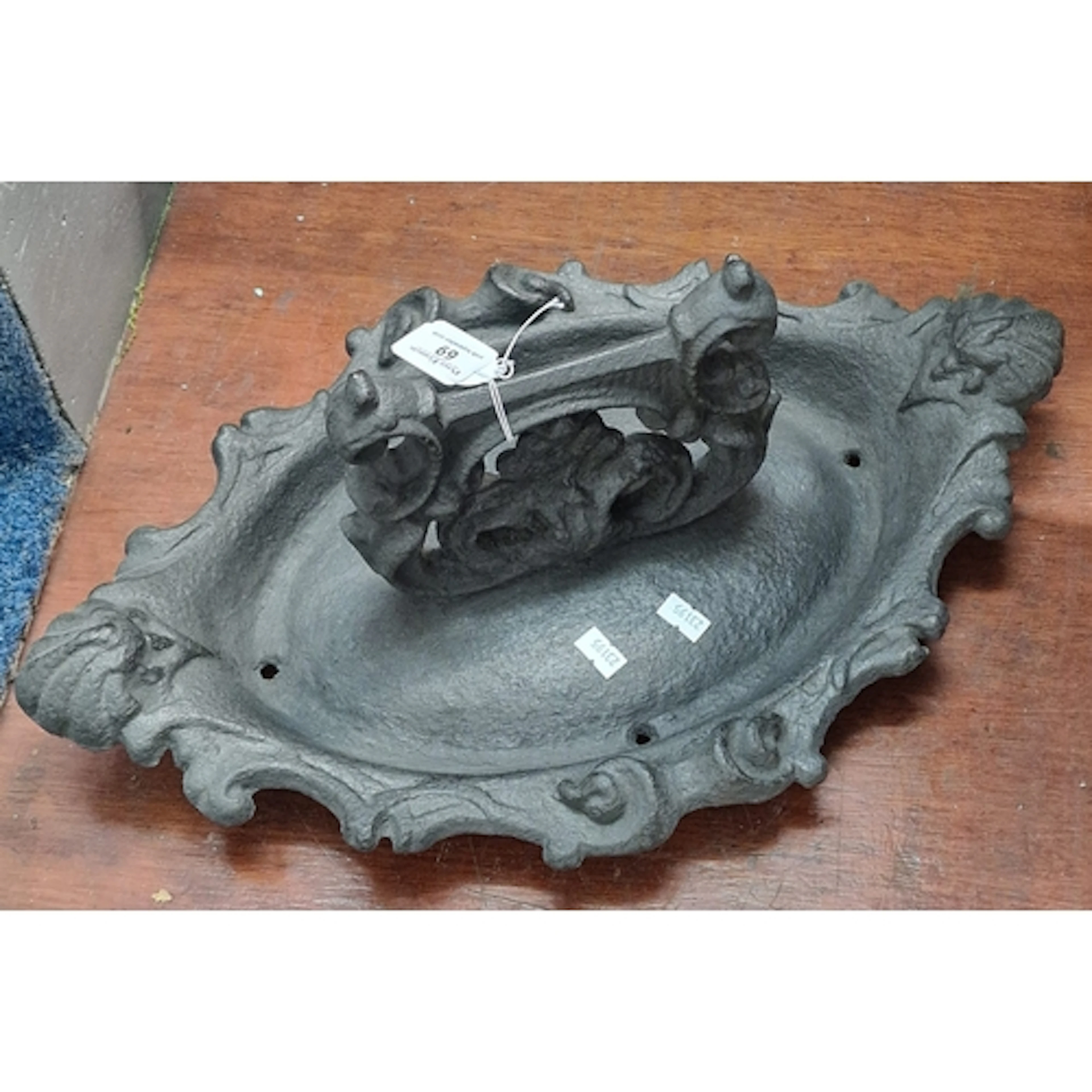 Victorian cast iron Rococo style boot scraper, marked to the...