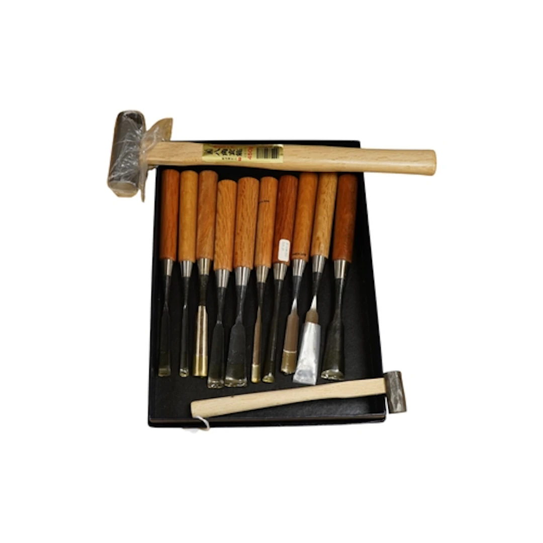 A set of ten Japanese wood working gouges, together with two...