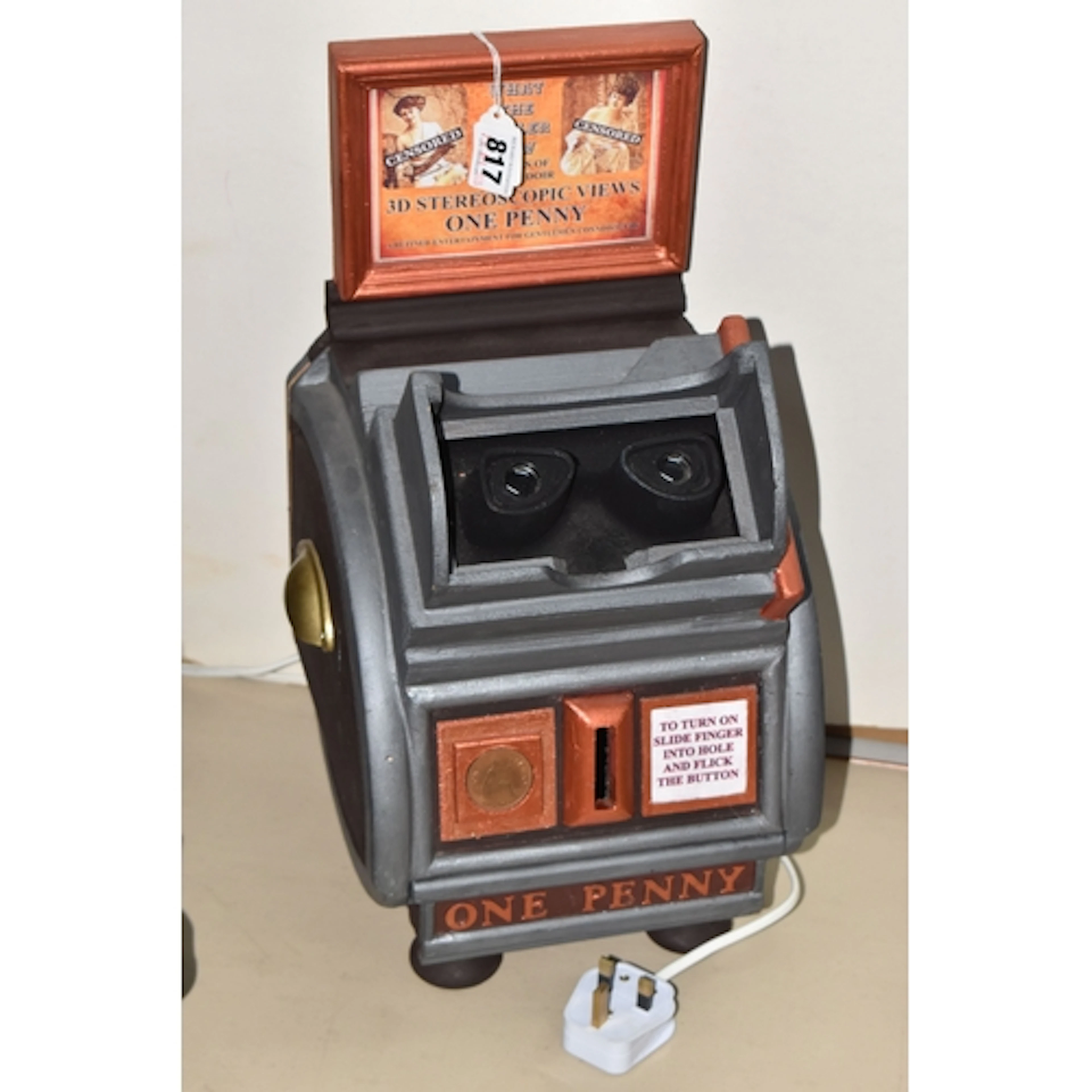 A REPRODUCTION 'ONE PENNY' MACHINE fitted with a light bulb ...