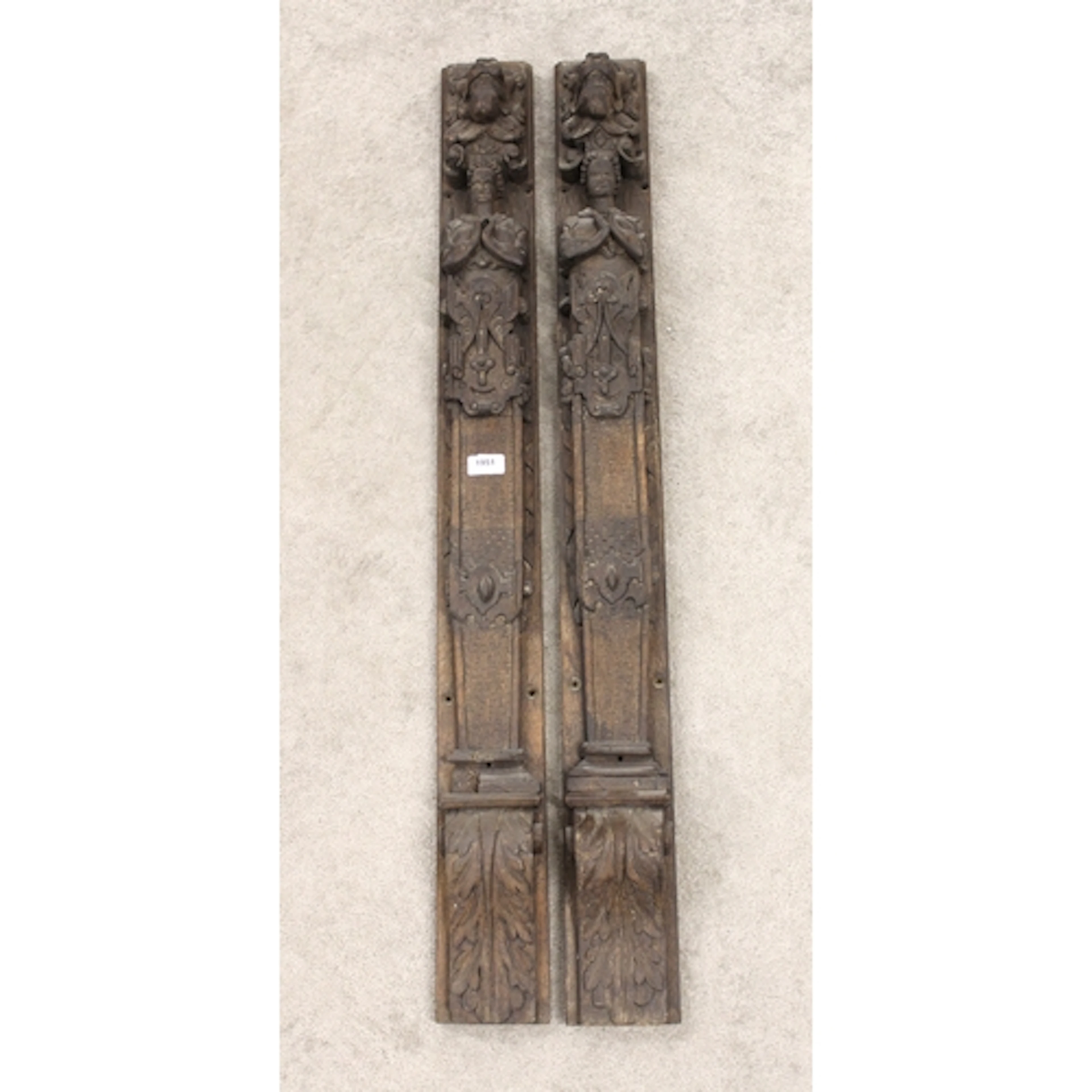 Pair of large antique carved oak pilasters, each in the form...