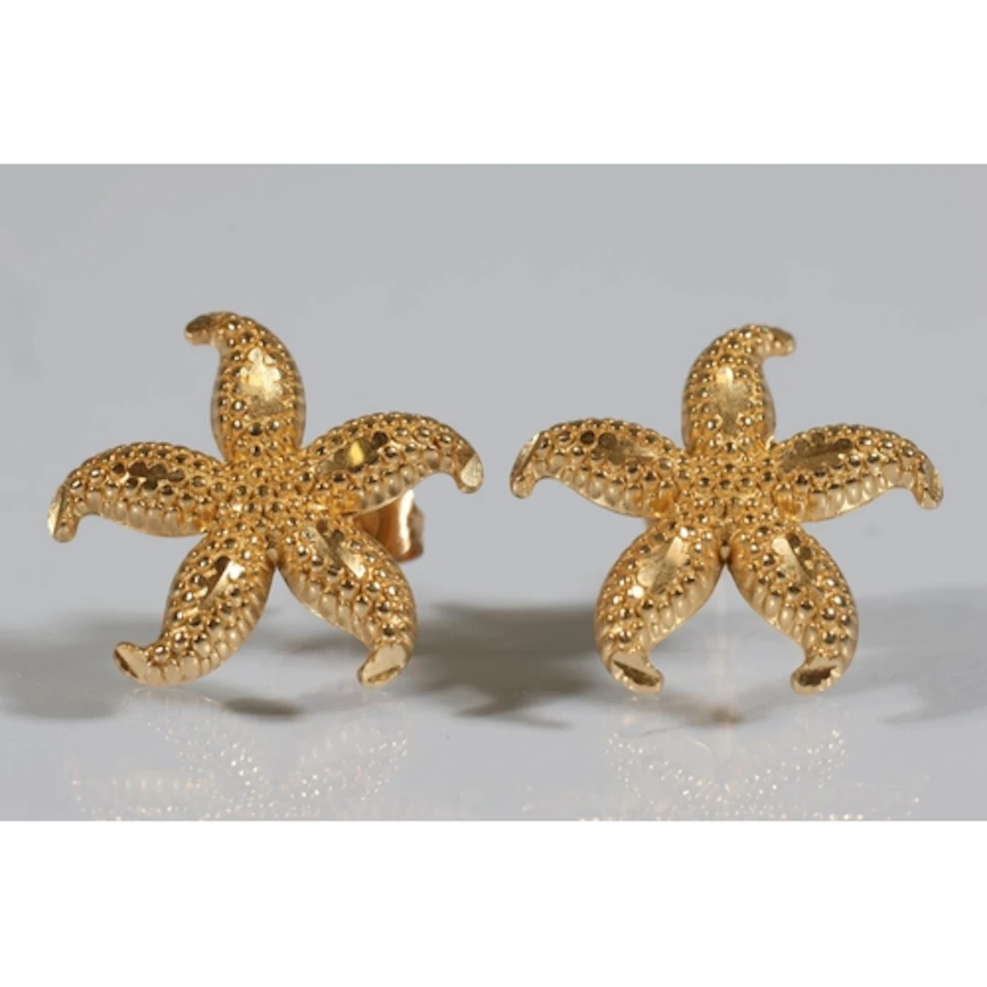 Pair of gold tone earrings in the form of starfish, marked '...