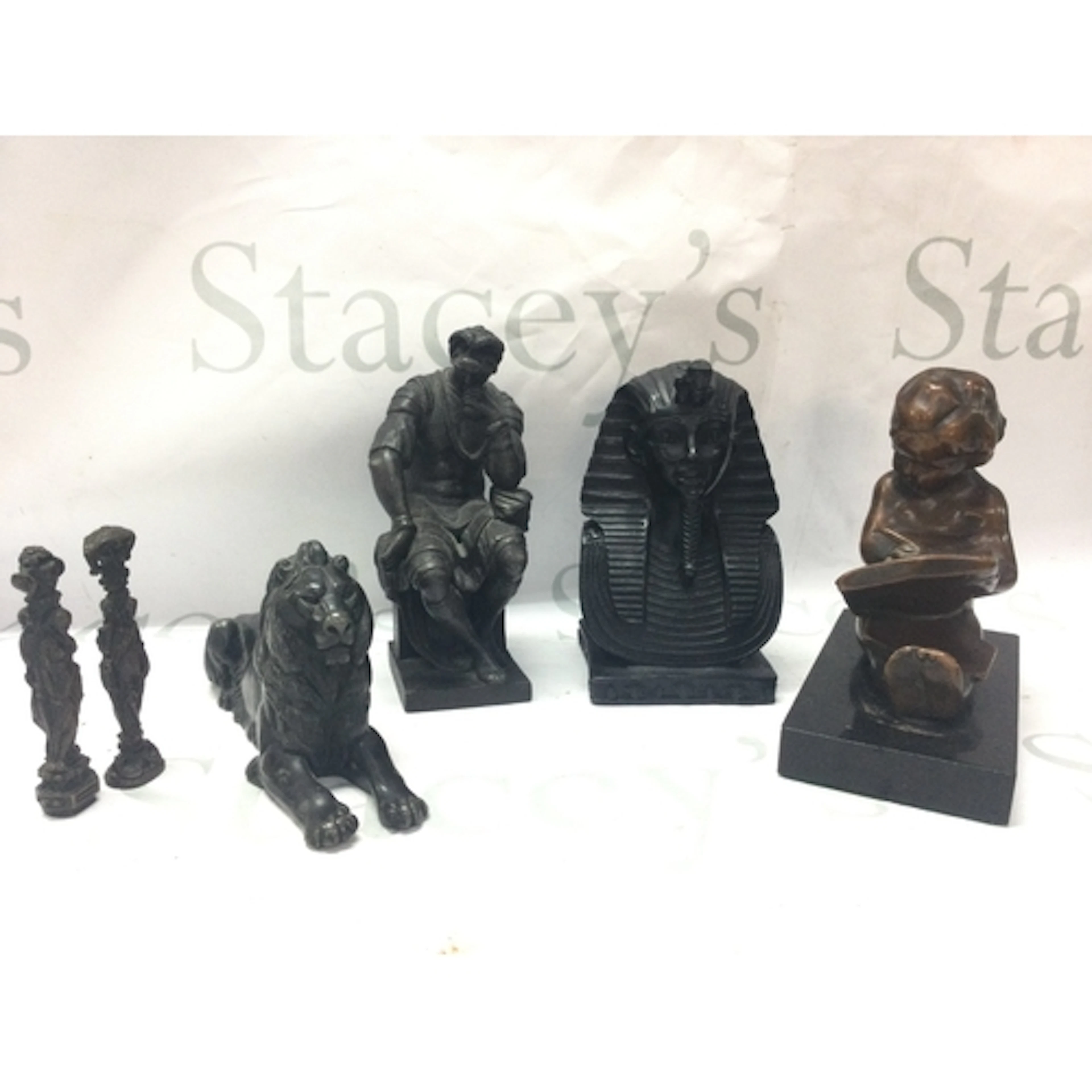 A Tutankhamen bust, lion figure, child reading book , Lorenz...
