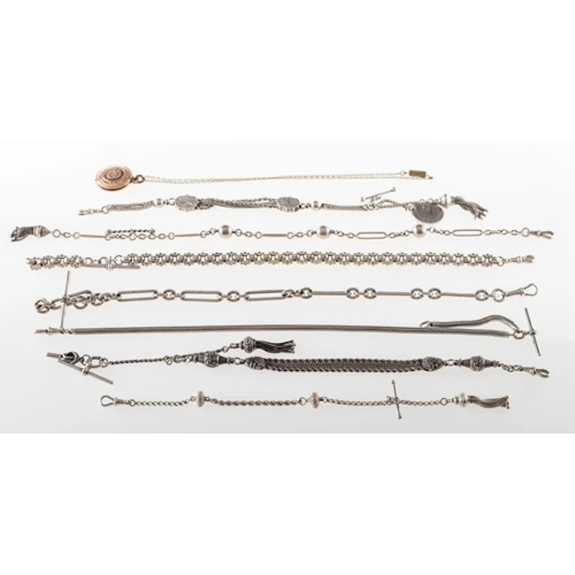 A group of seven watch chains and a souvenir pendant, seven ...
