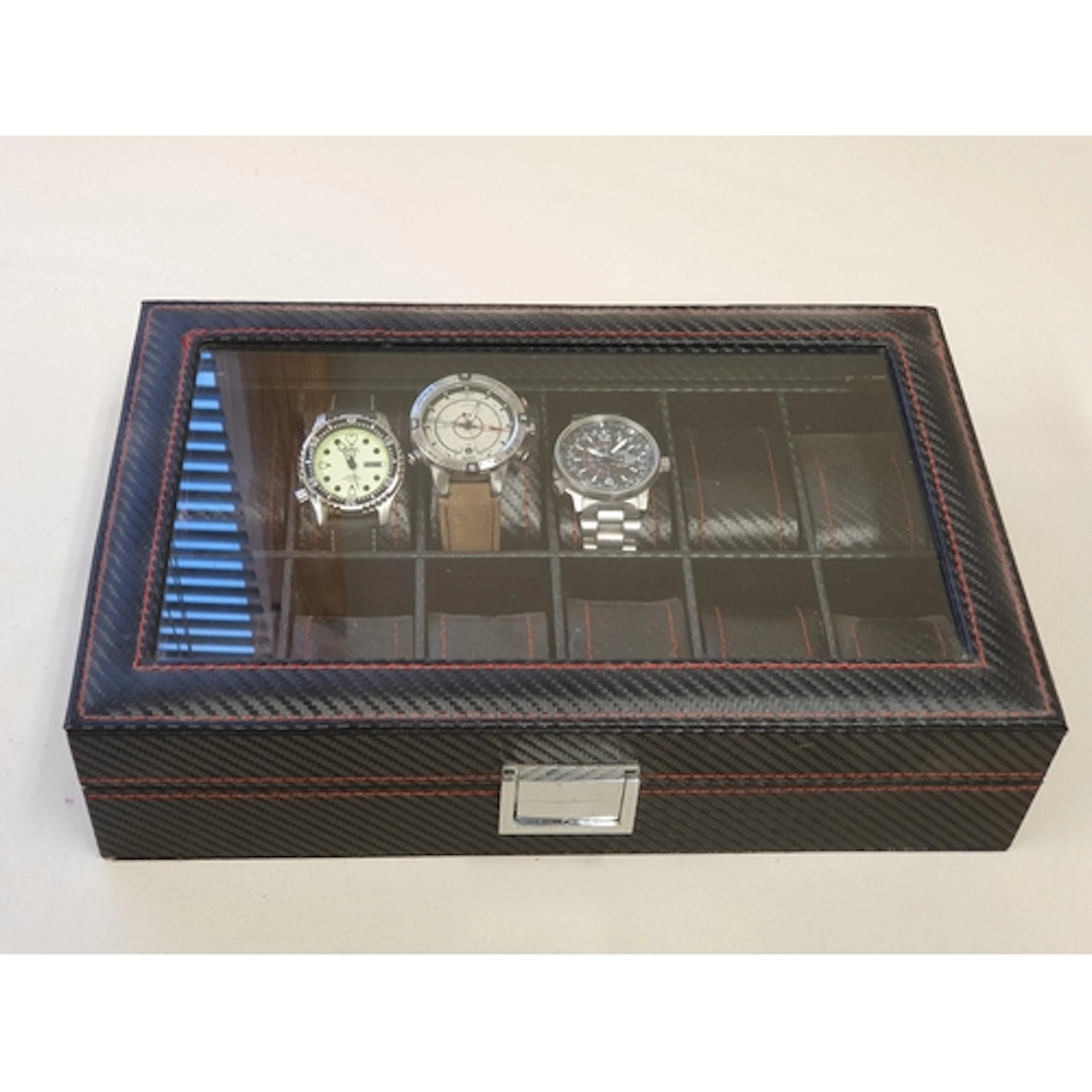 A watch display case with three gentleman's wristwatches: a ...
