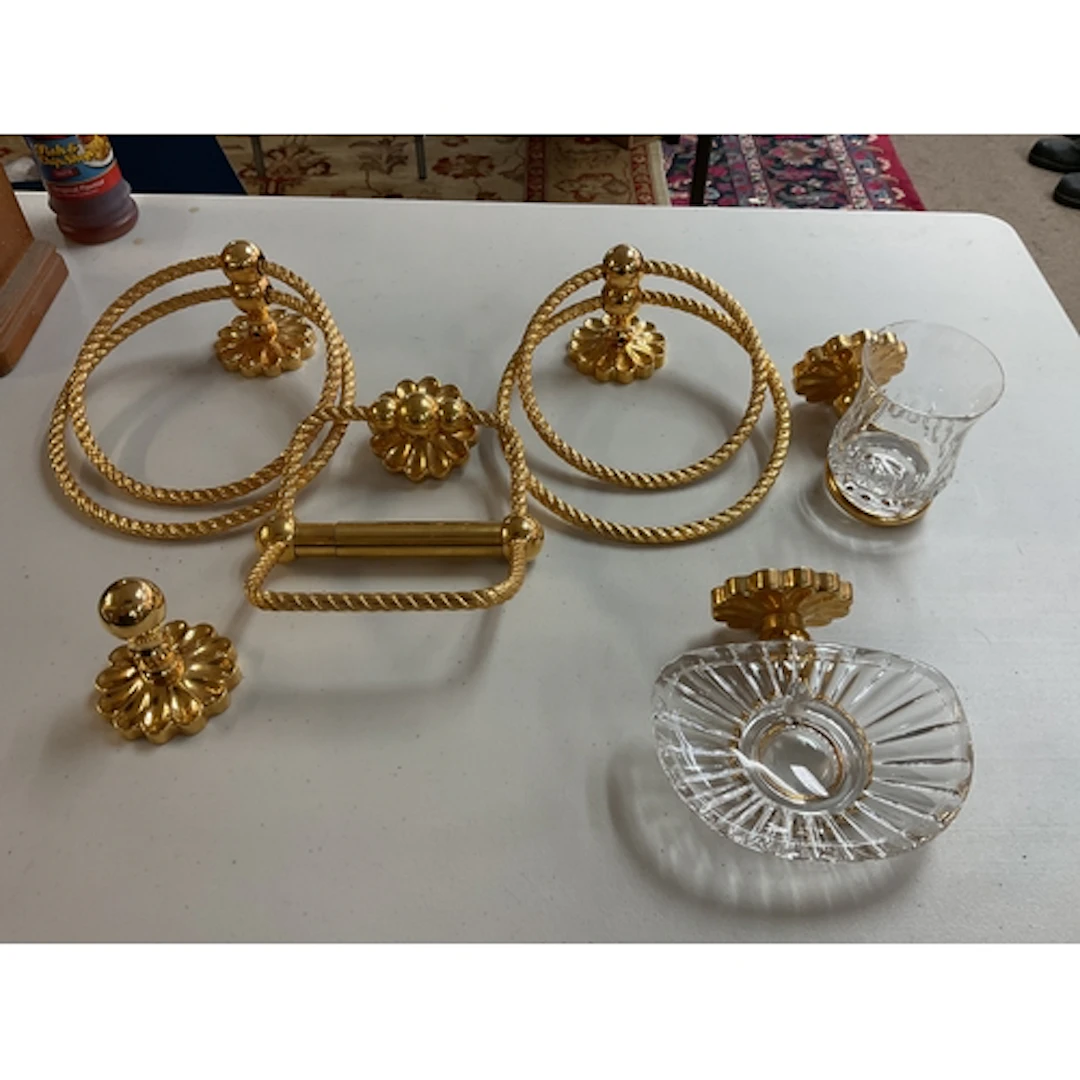 Gilded ornate bathroom set.