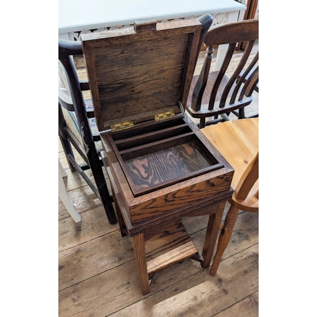 A small oak lift top workbox