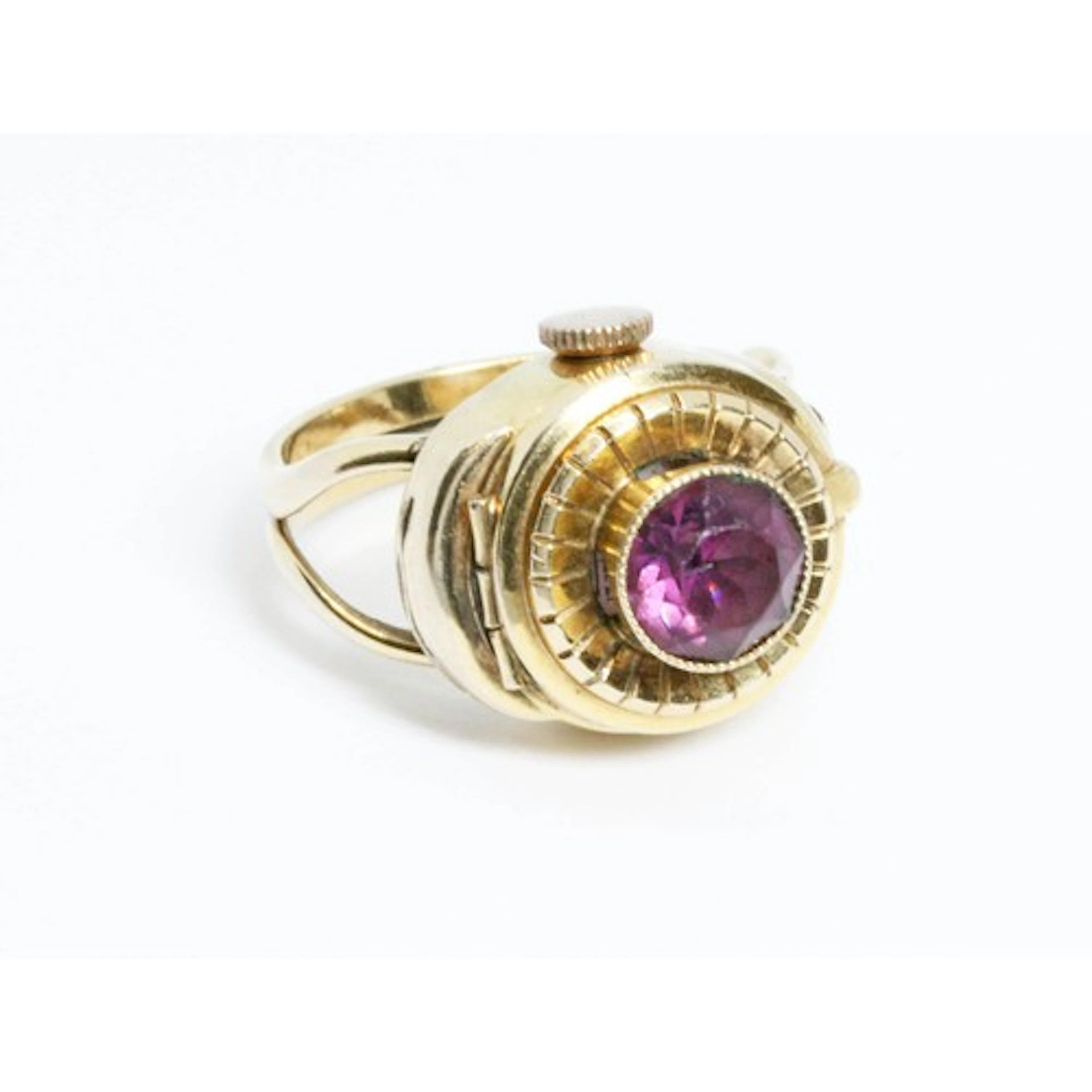 A vintage gold plated ring watch, the top set with purple pa...