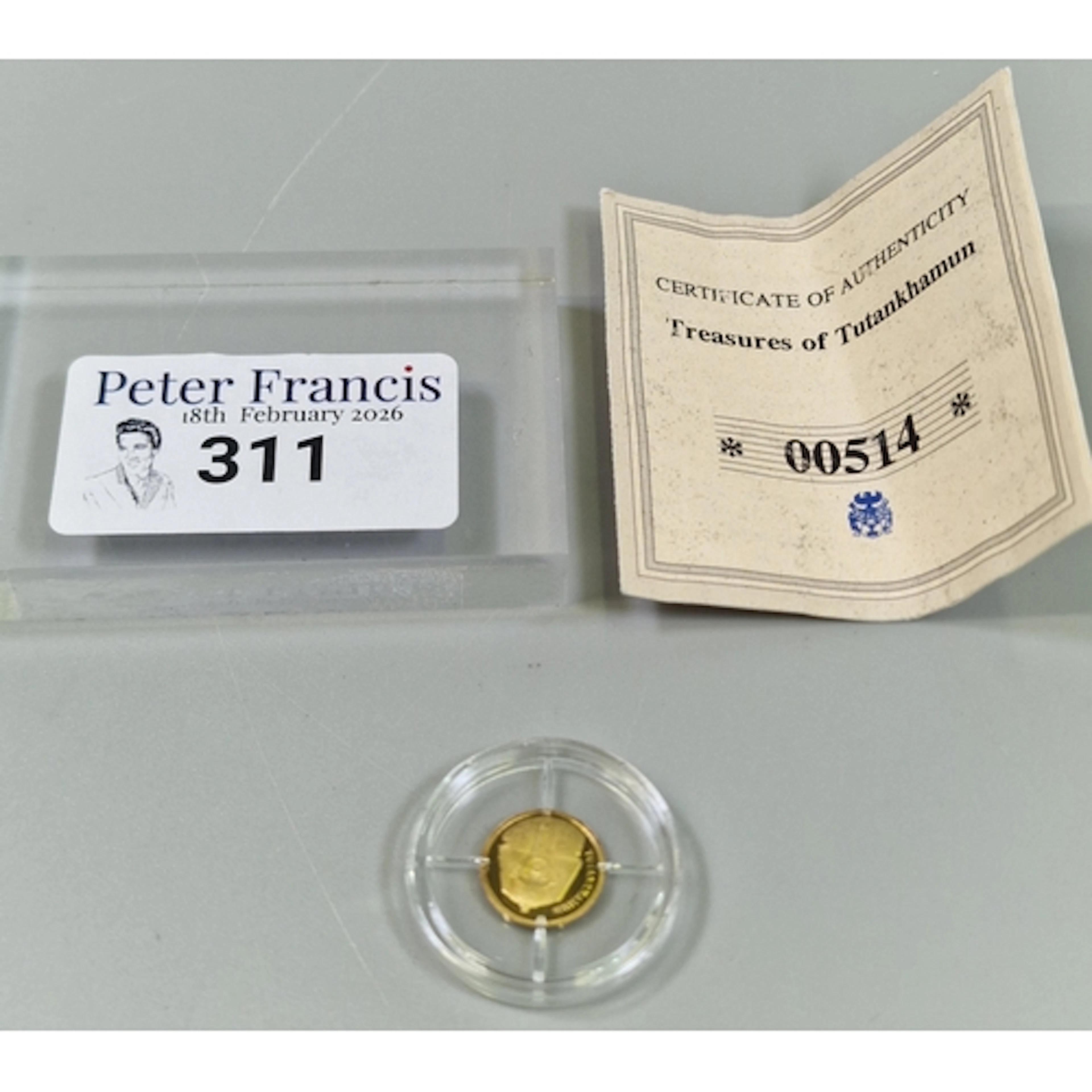 14ct gold 585 Tutankhamun coin dated 2009, in plastic capsul...
