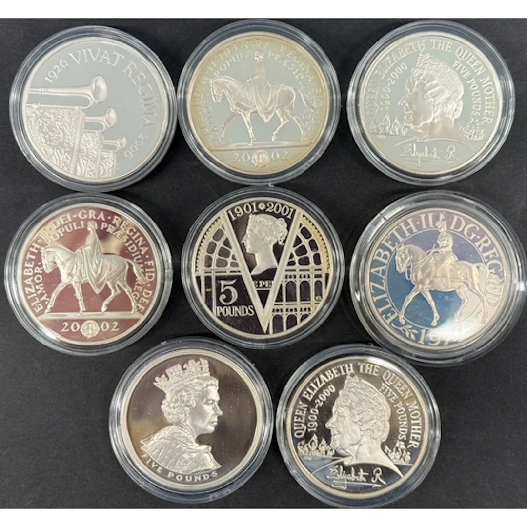A group of eight UK QEII silver proof Crowns and £5 coins, i...