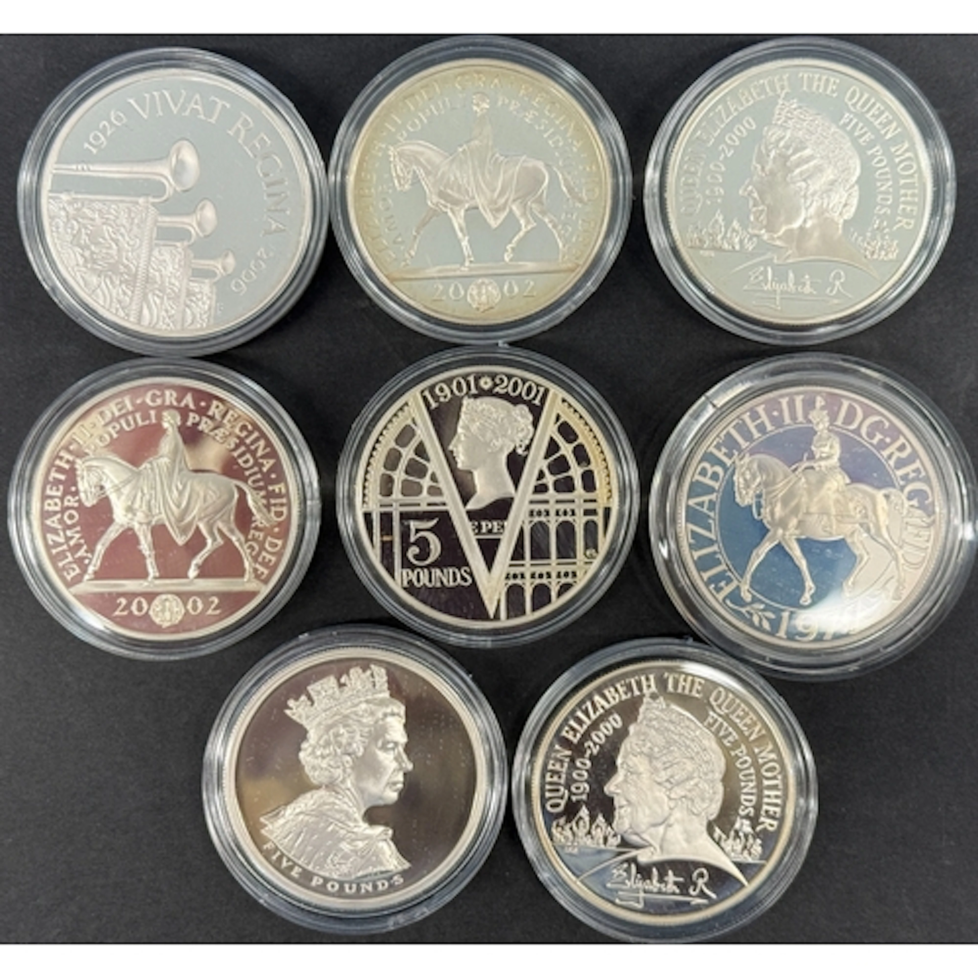 A group of eight UK QEII silver proof Crowns and £5 coins, i...
