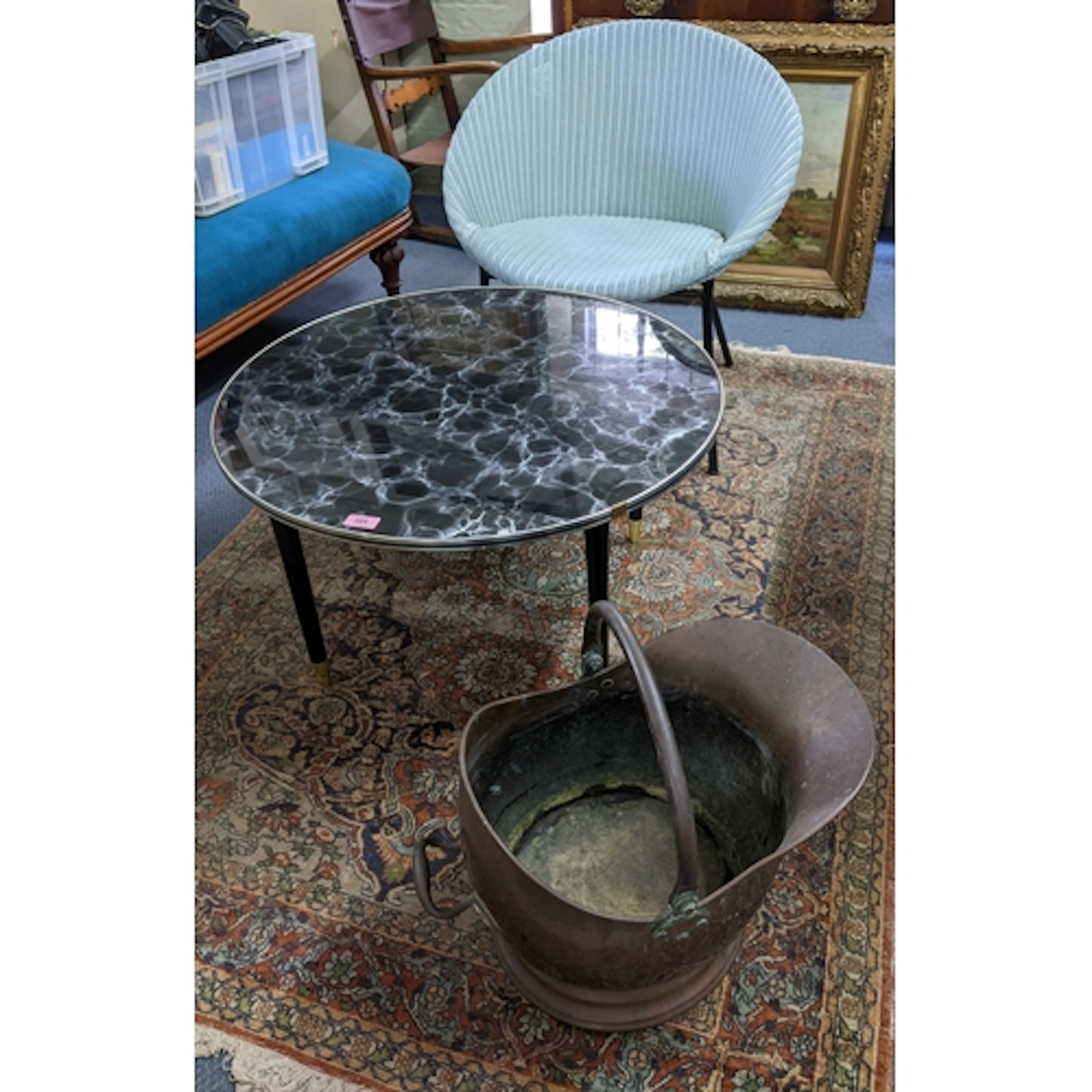 A vintage Lloyd Loom Lusty product chair in light blue, stan...