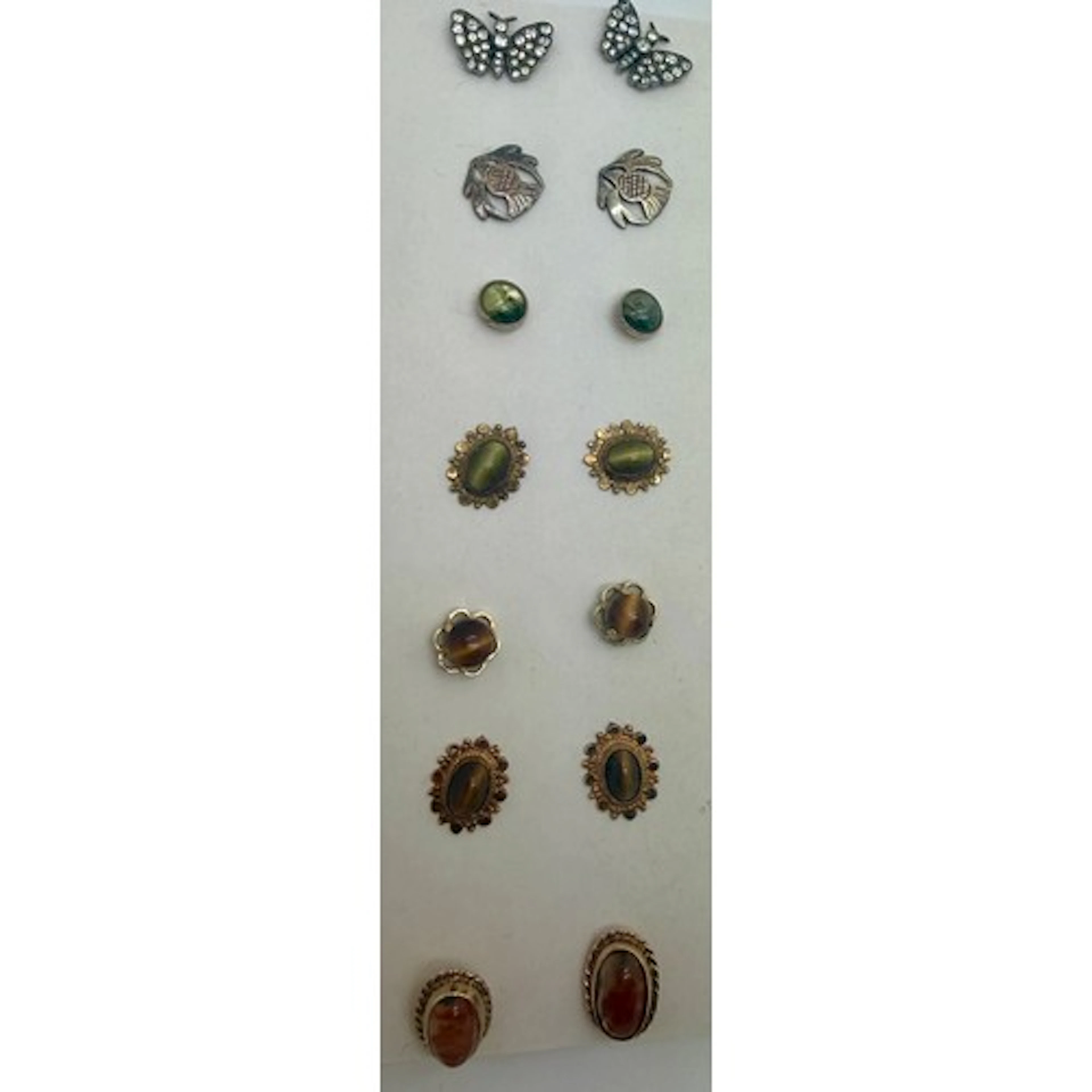 Seven pairs of earrings to include 9 carat gold mounted, tig...