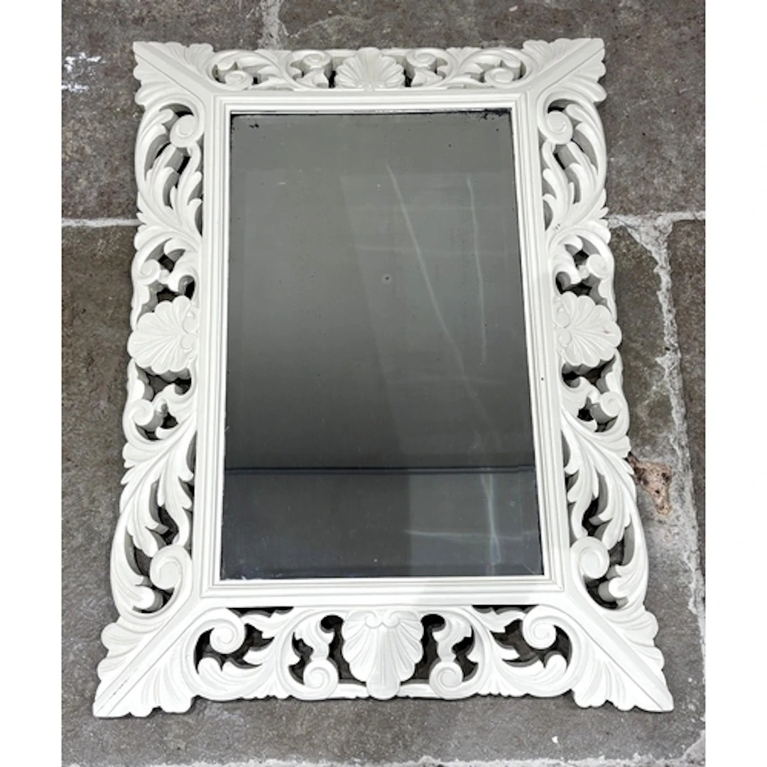 A modern painted wall mirror, the bevelled plate in swept wo...