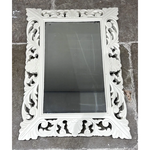 A modern painted wall mirror, the bevelled plate in swept wo...