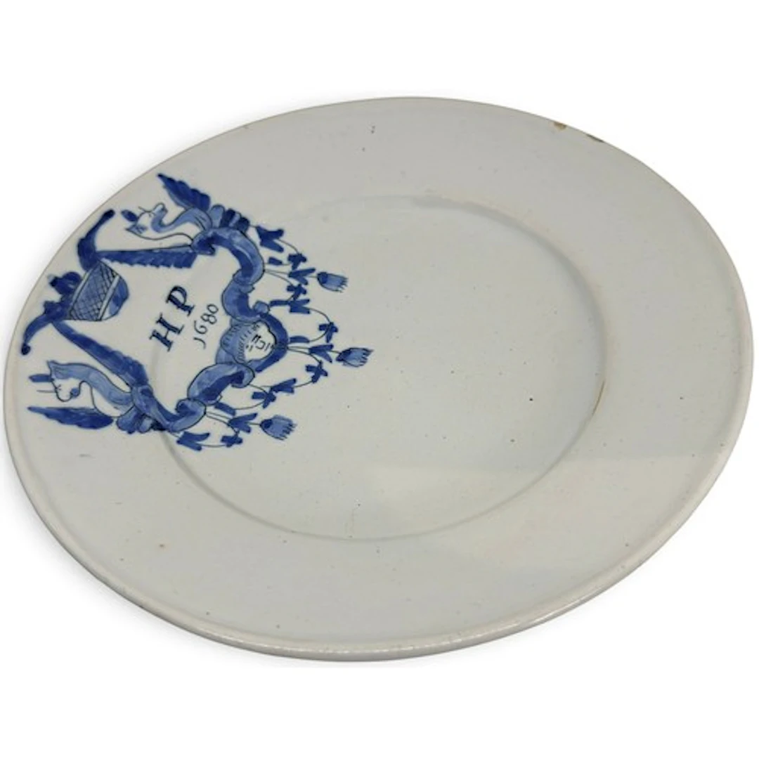 A Charles II period English blue and white Delft plate, with...