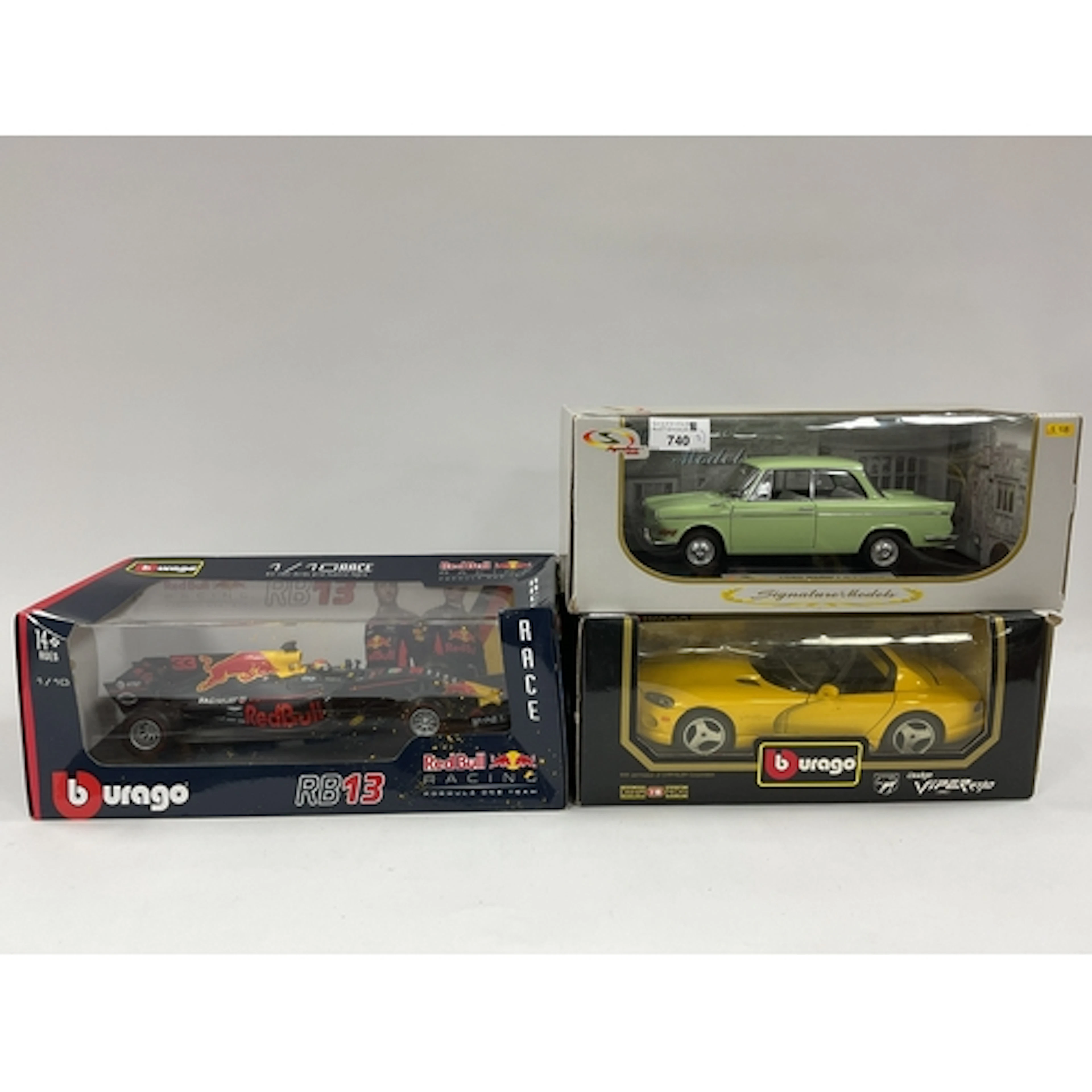 Three 1:18 scale diecast model cars comprising of Burago Red...