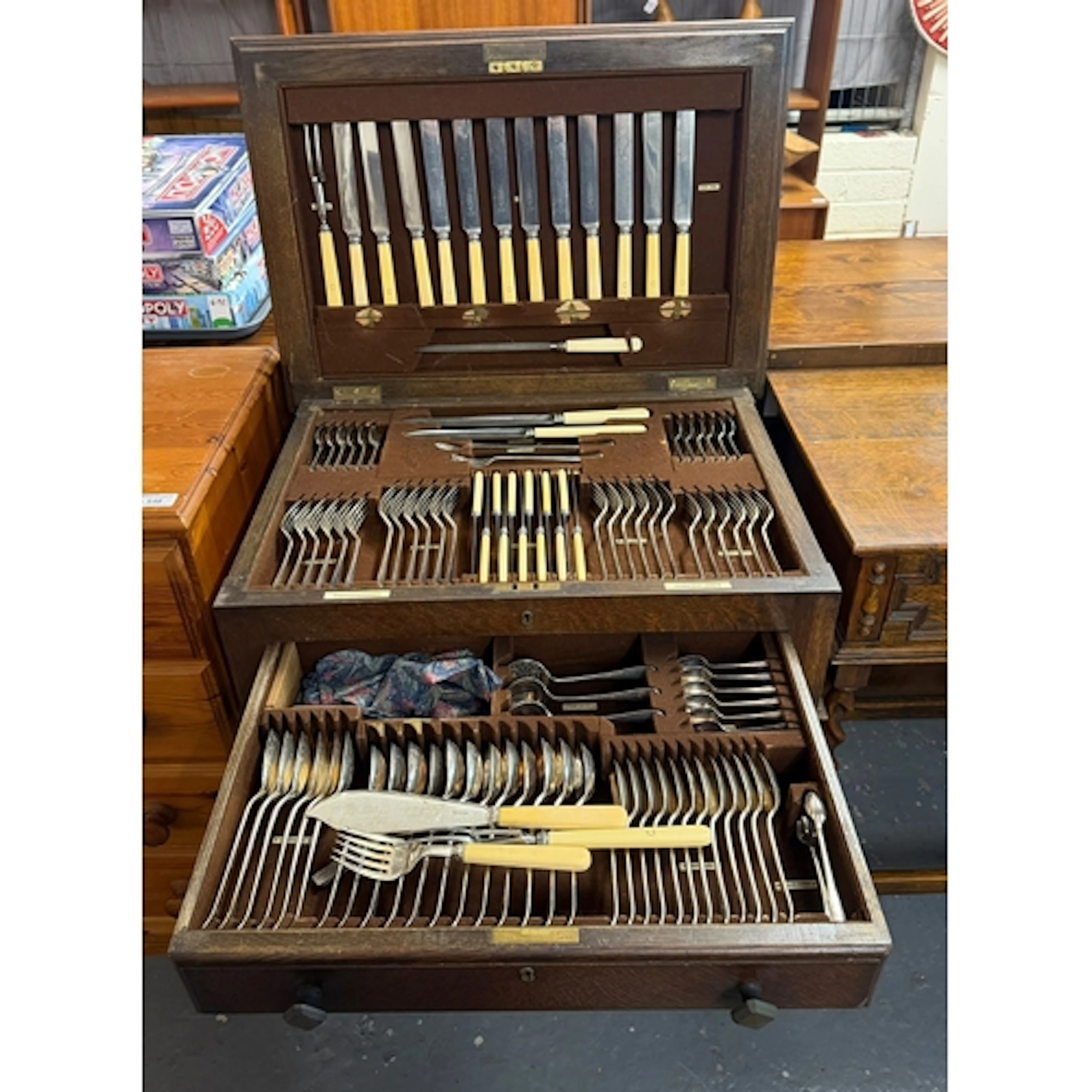 Early 20th century oak cased cutlery canteen containing a la...