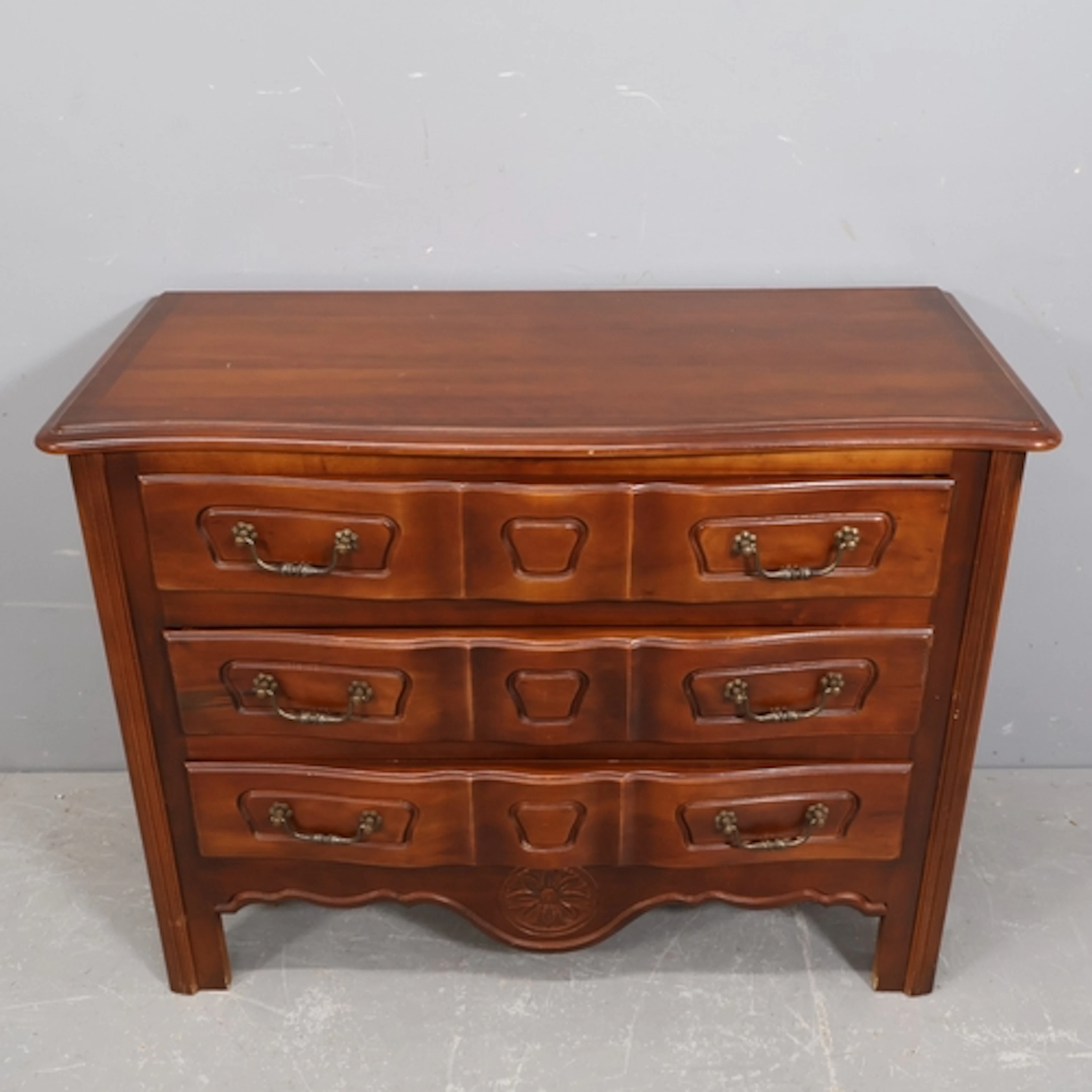 A modern French Louis XV style commode chest of three long d...