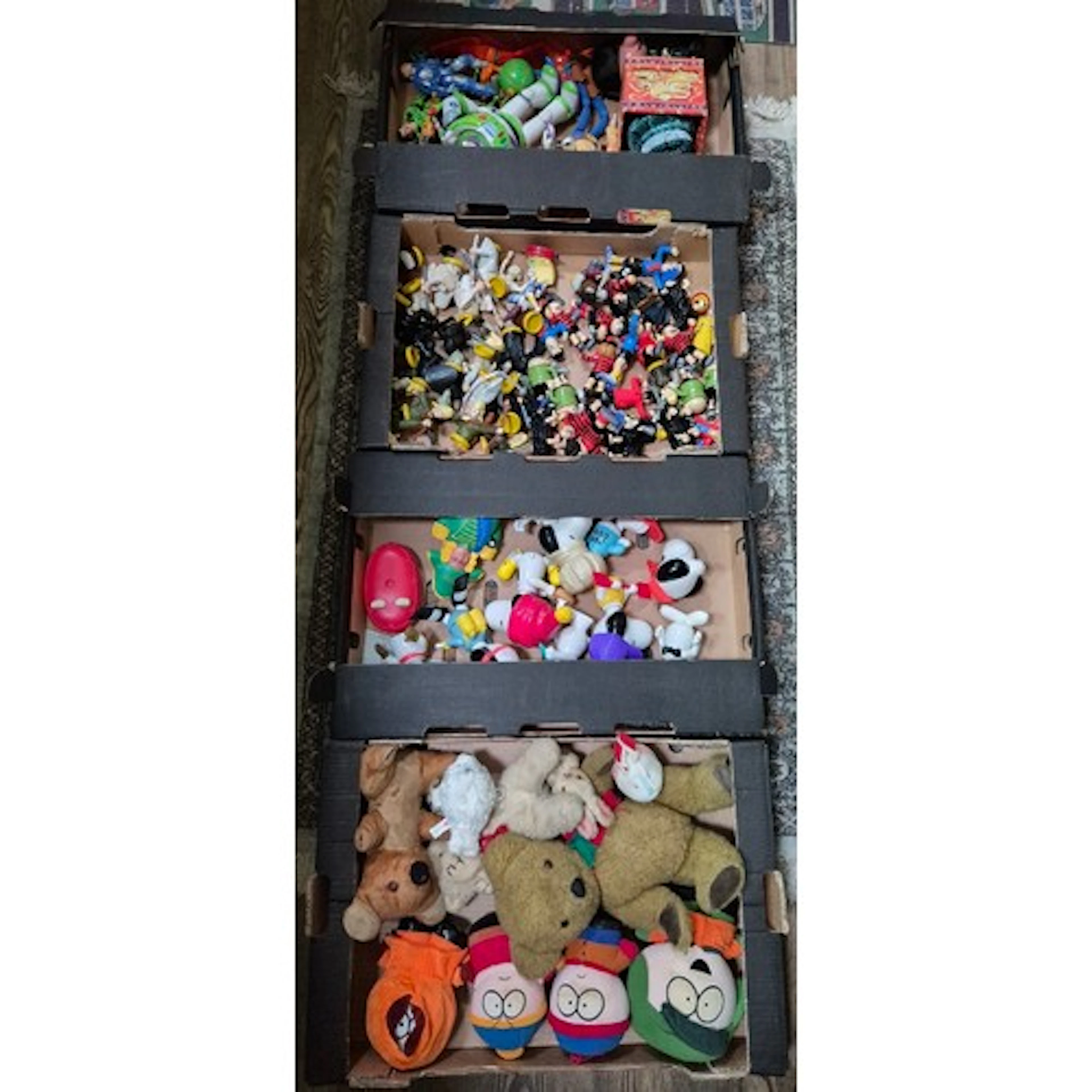 Four boxes of assorted vintage toys to include Buzz Lightyea...