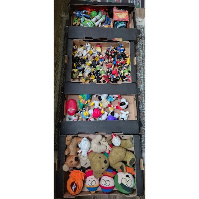 Four boxes of assorted vintage toys to include Buzz Lightyea...