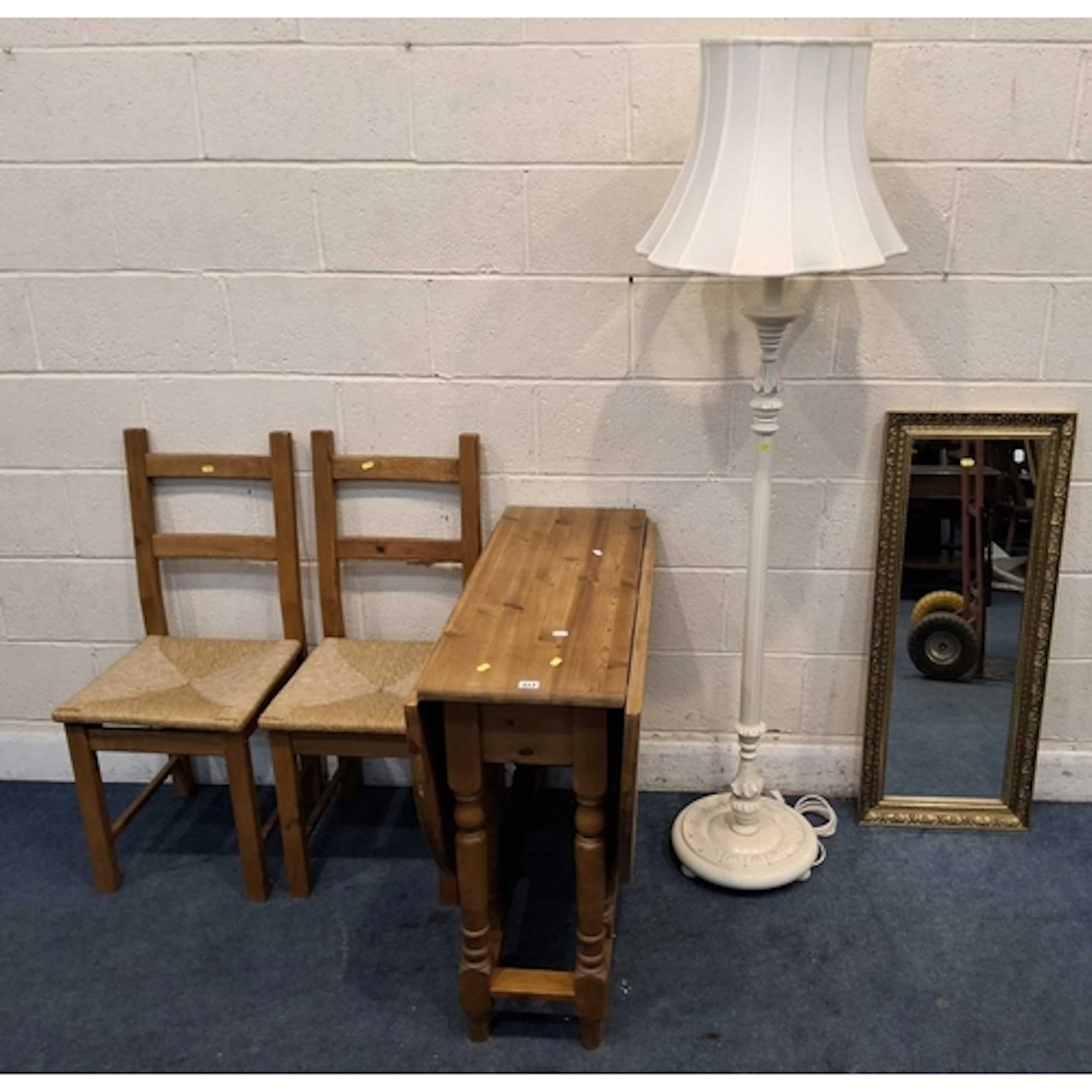 A MODERN PINE GATE LEG TABLE, a pair of chairs, a wall mirro...