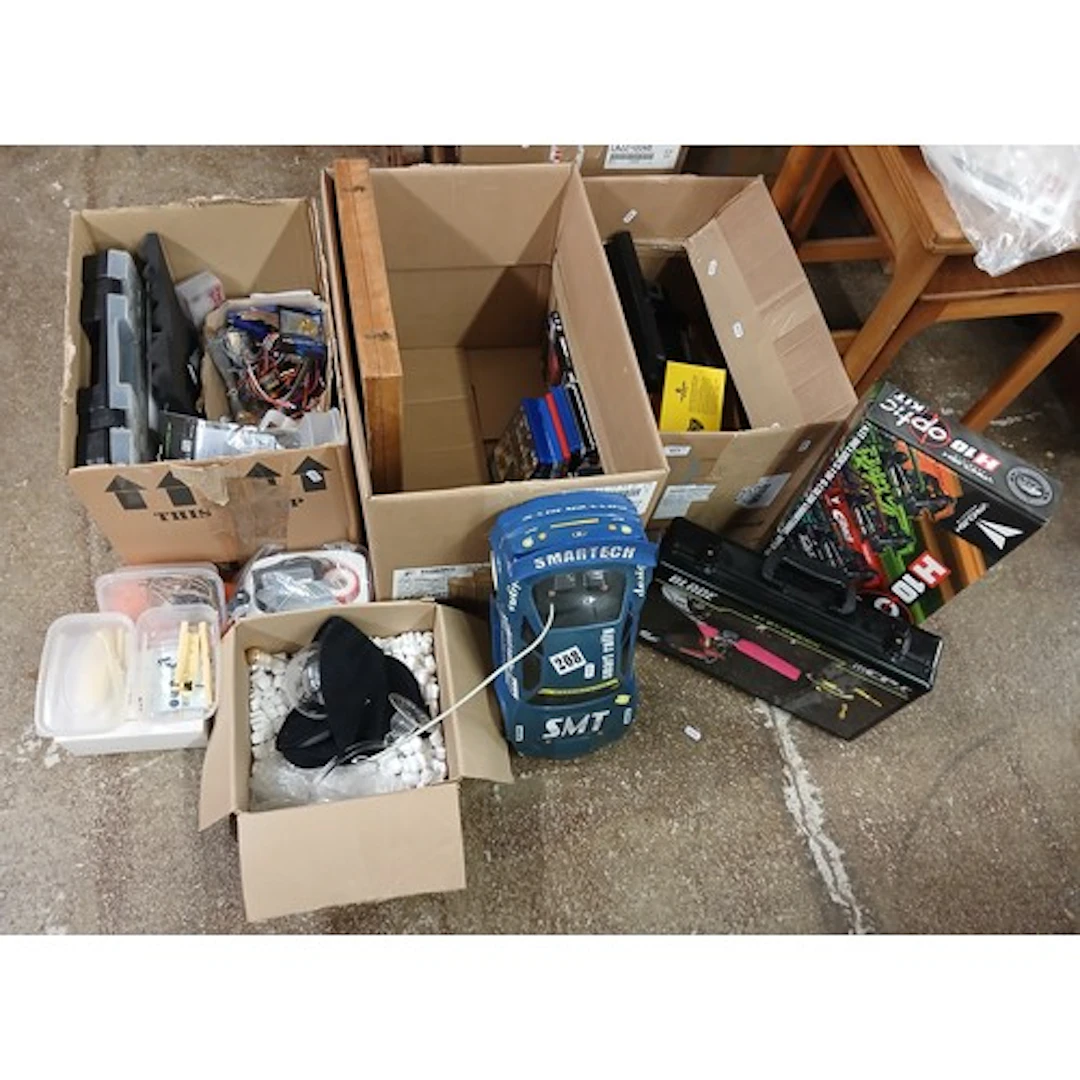 Three boxes of assorted model cars, parts, glass decanters, ...