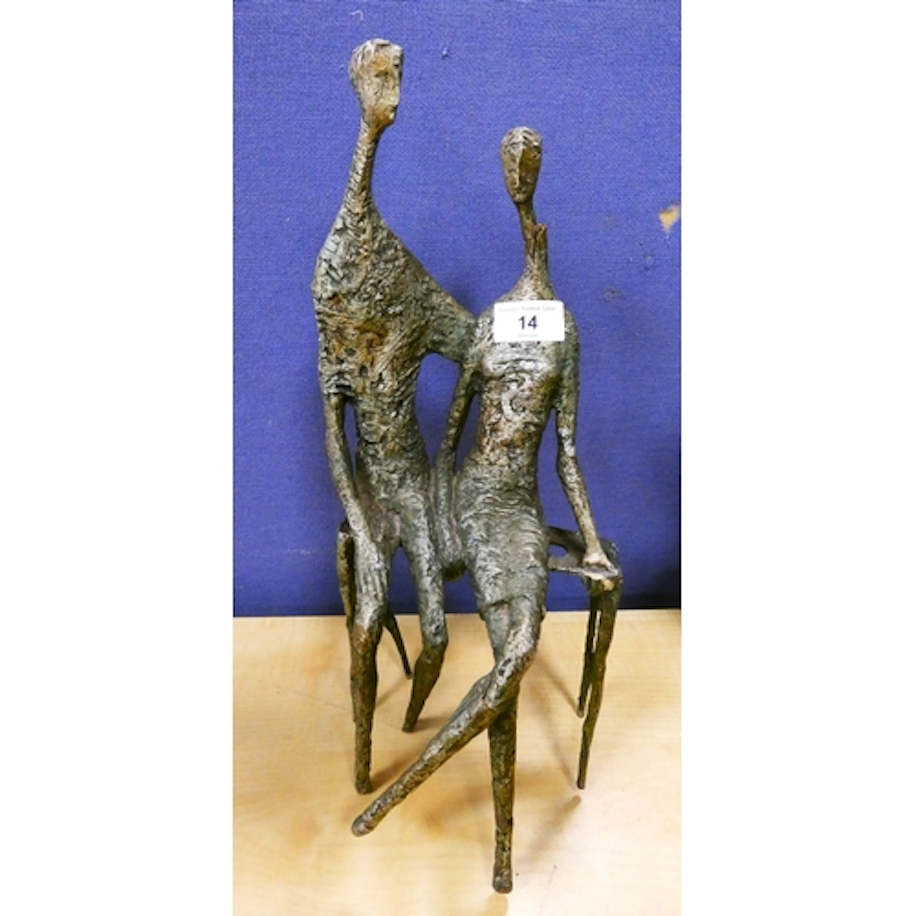 Modernist verdigris sculpture modelled as a couple embracing...