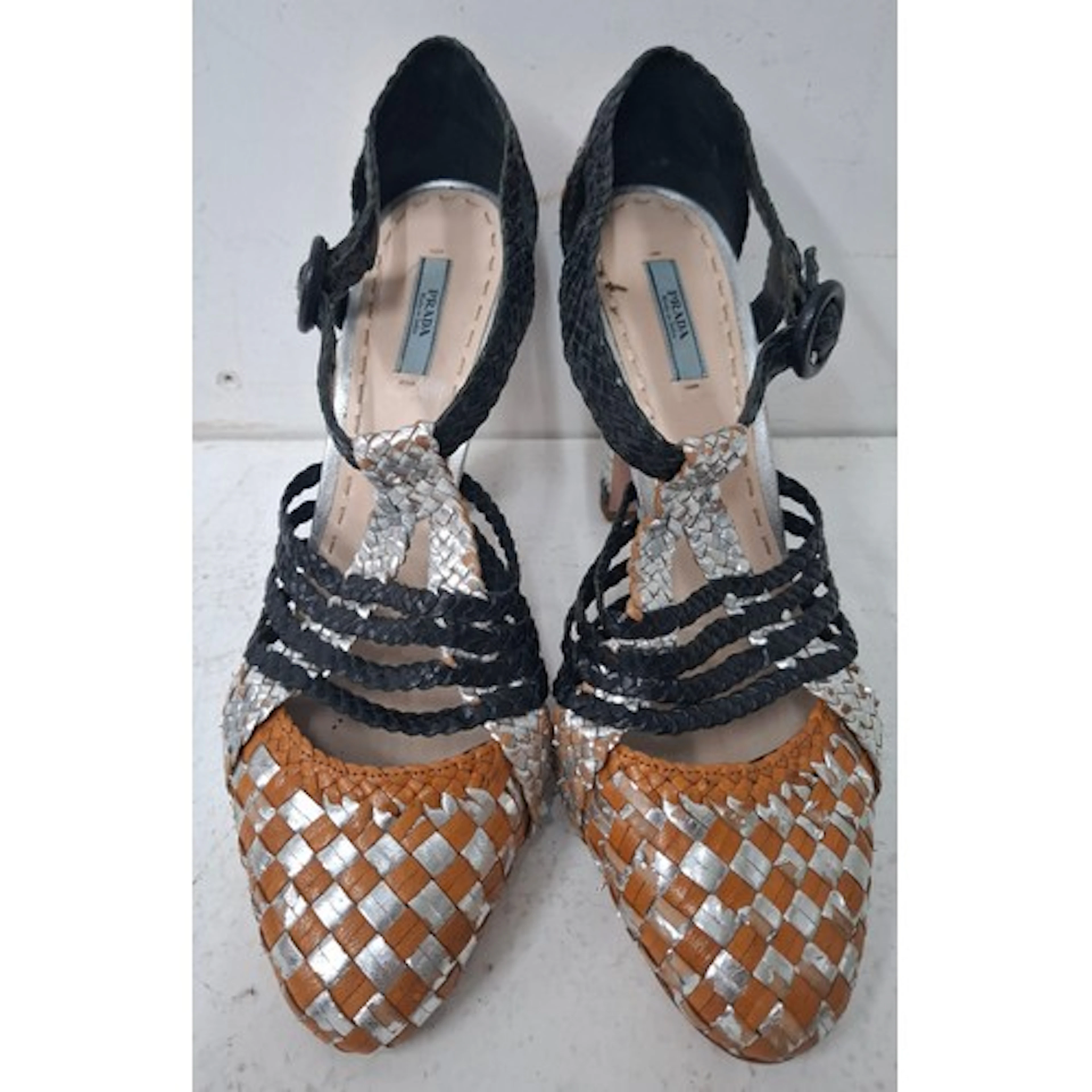Prada- A pair of vintage high heel shoes having a black, sil...