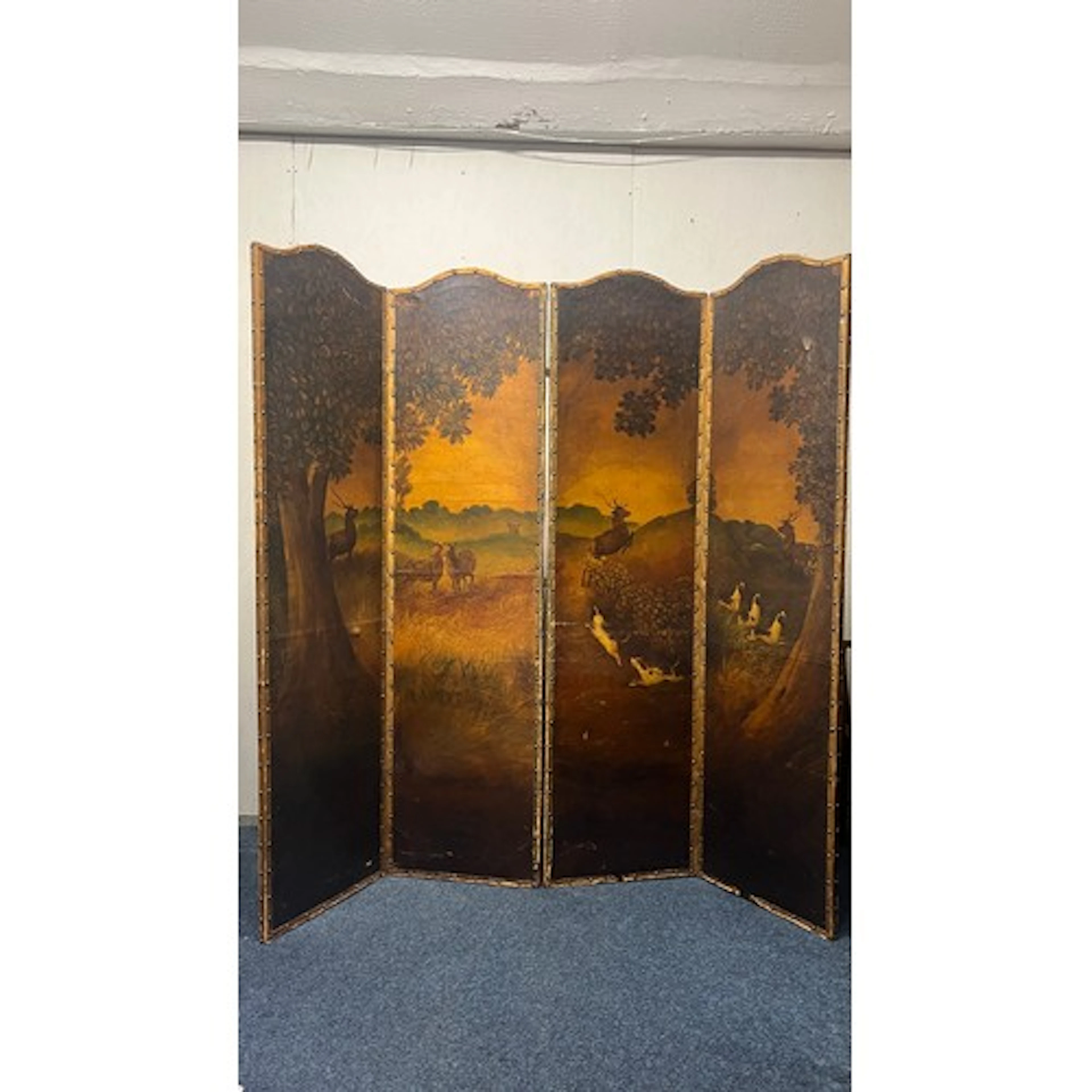 Late Victorian four-fold painted screen depicting deer and h...