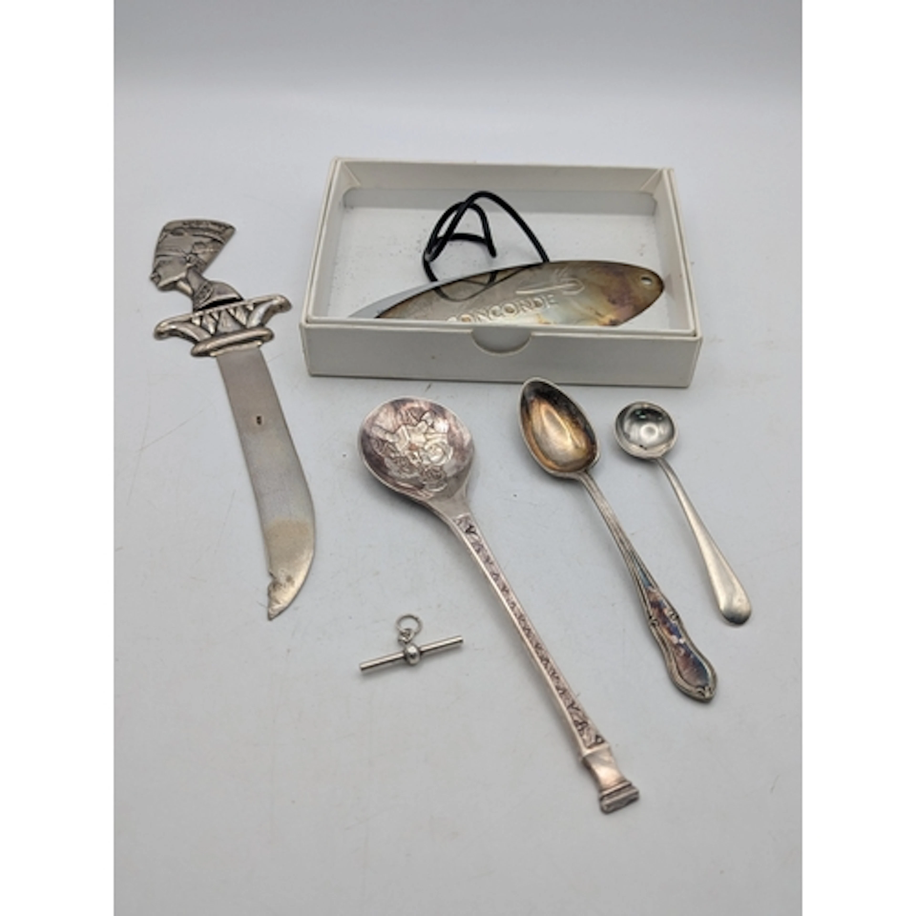 Silver to include a Concorde tag, an Egyptian letter opener,...
