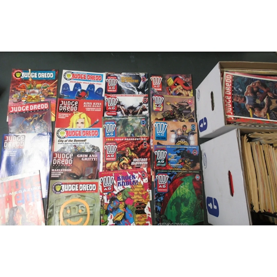 Box containing a collection of Judge Dredd comics, together ...
