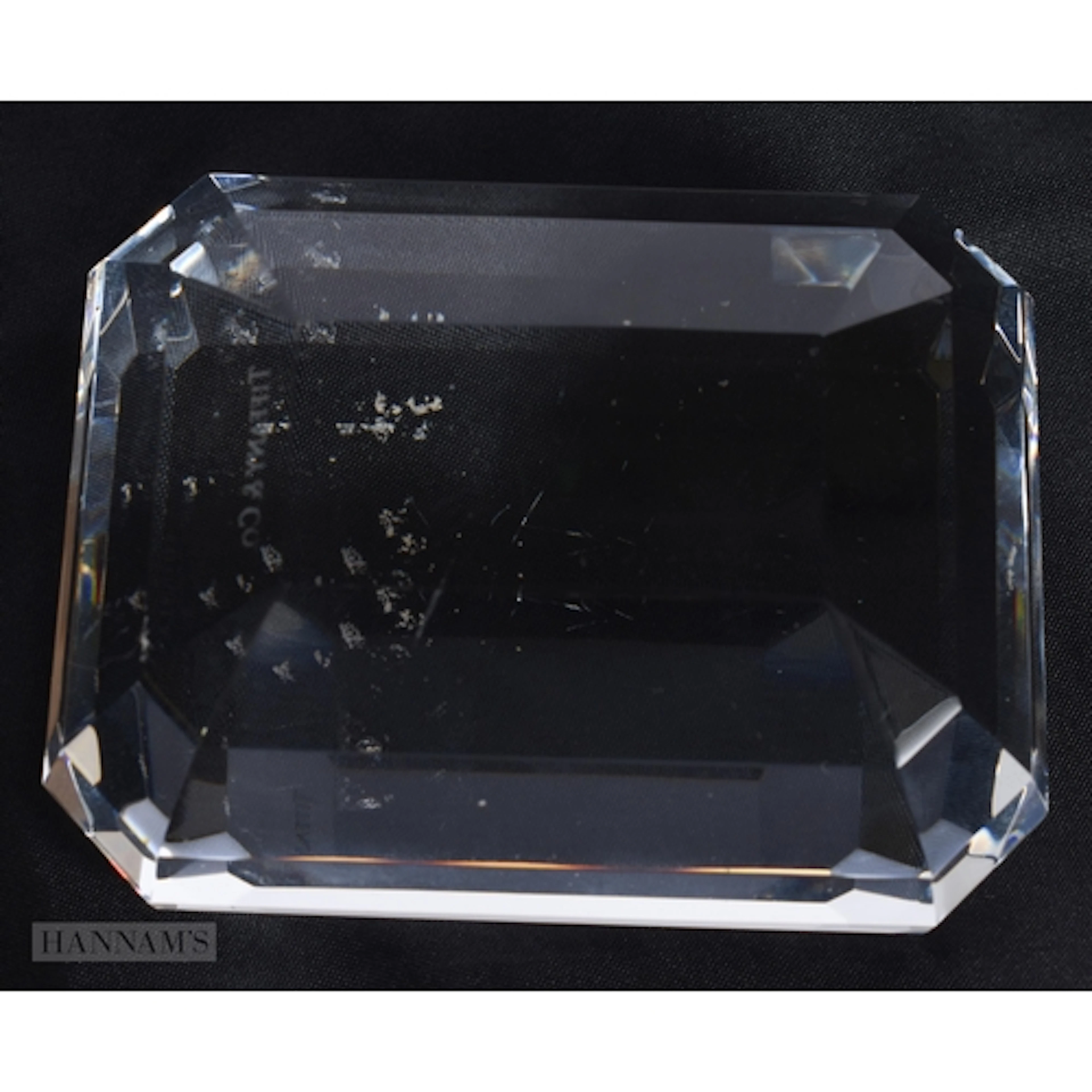 A TIFFANY & CO GLASS DIAMOND PAPERWEIGHT. 9 cm x 7 cm.