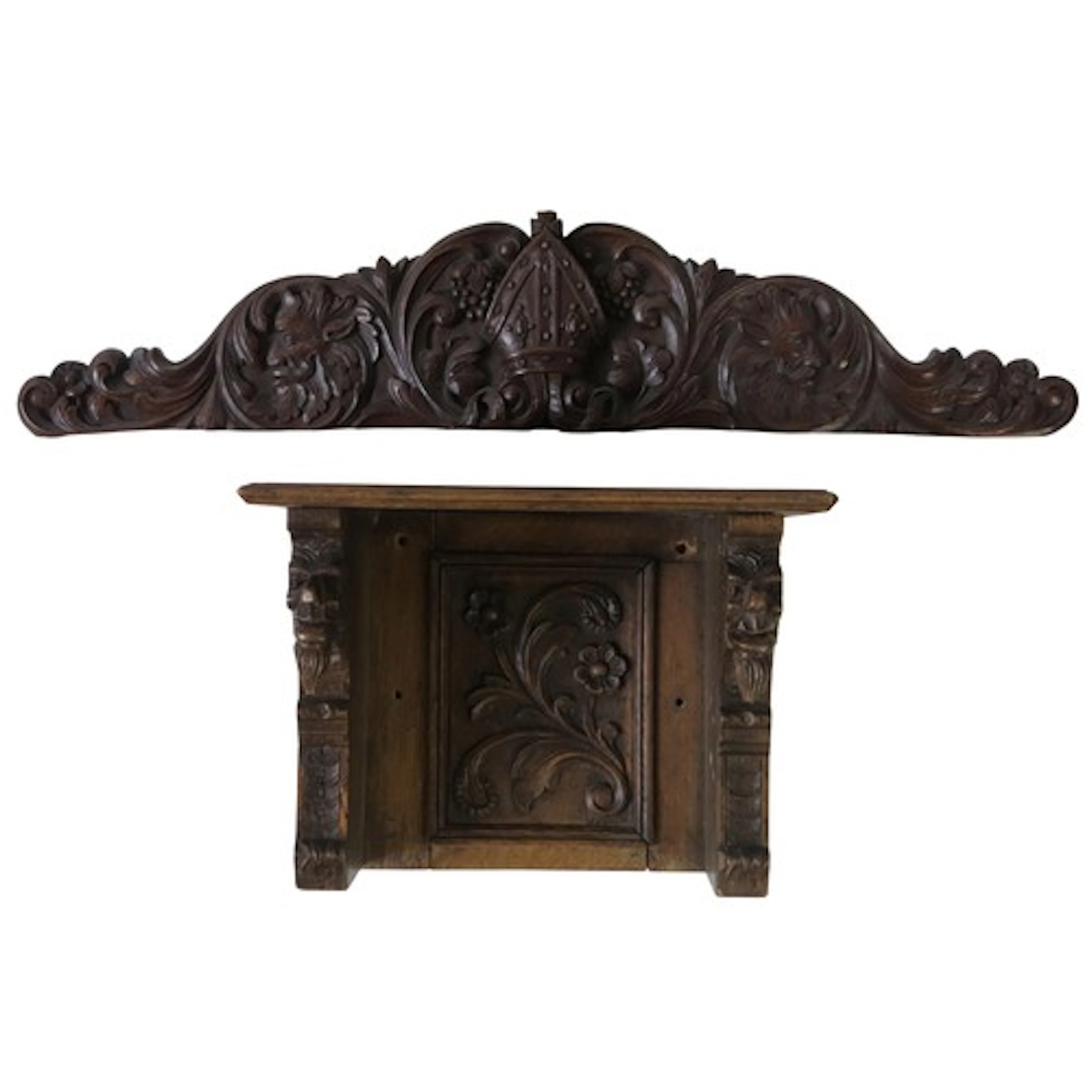 A CARVED OAK WALL NICHE AND PEDIMENT with central mitre moti...