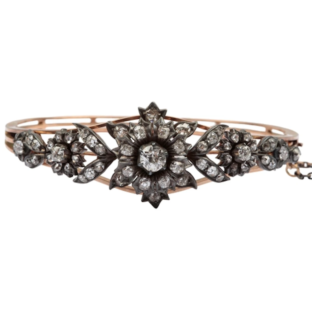 A Victorian diamond bangle, late 19th century, the hinged go...