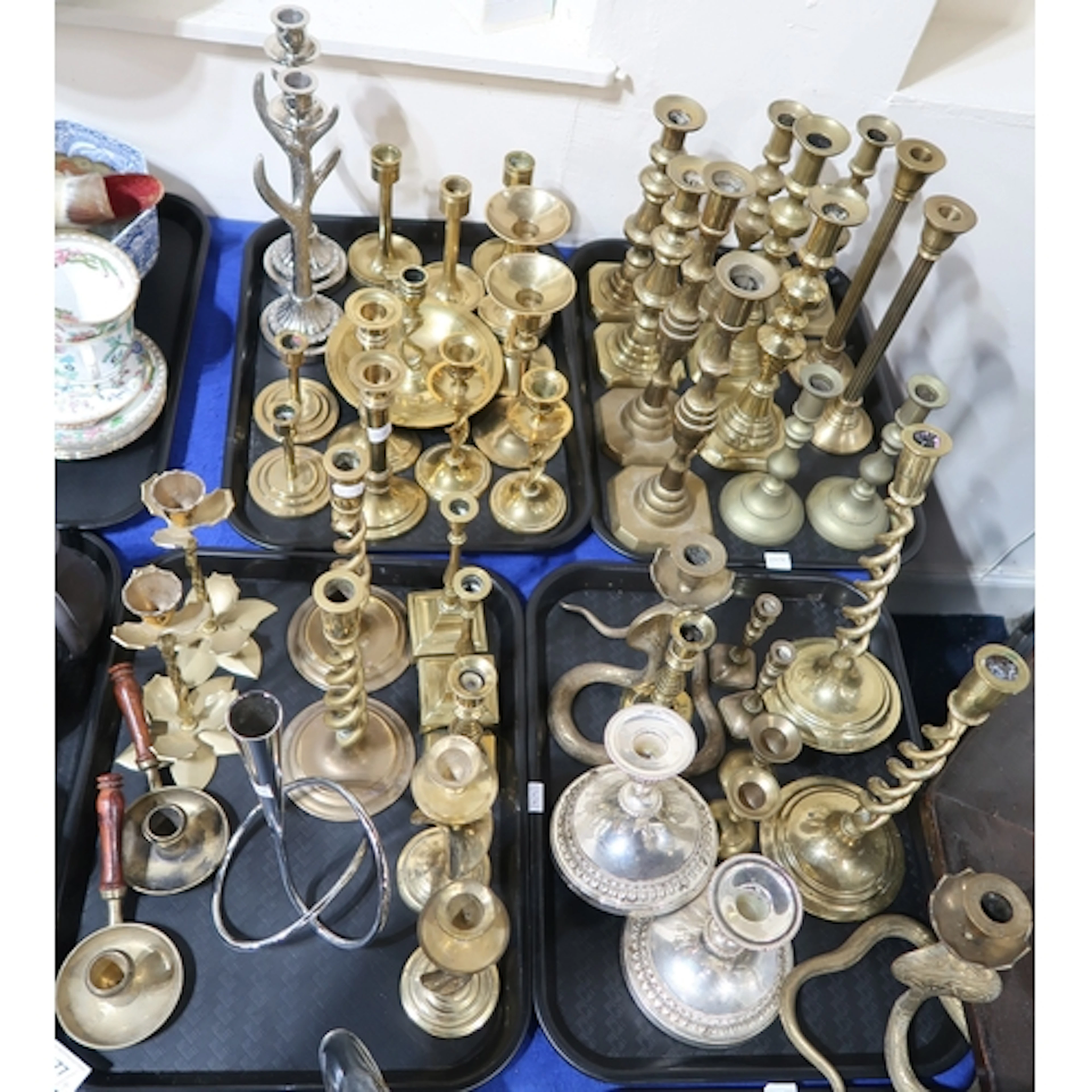 A quantity of brass and other candlesticks including a pair ...