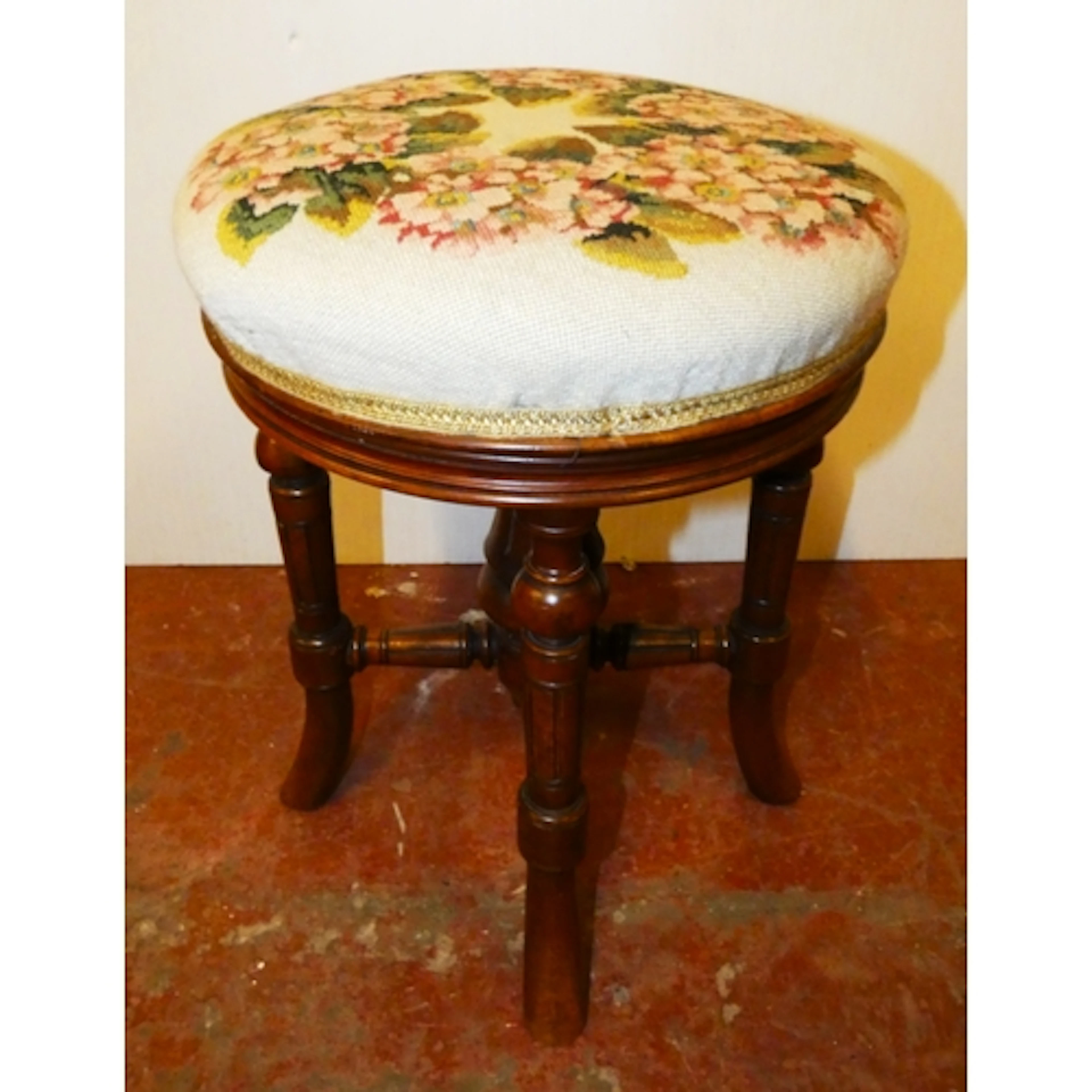 Victorian mahogany piano stool with revolving floral tapestr...